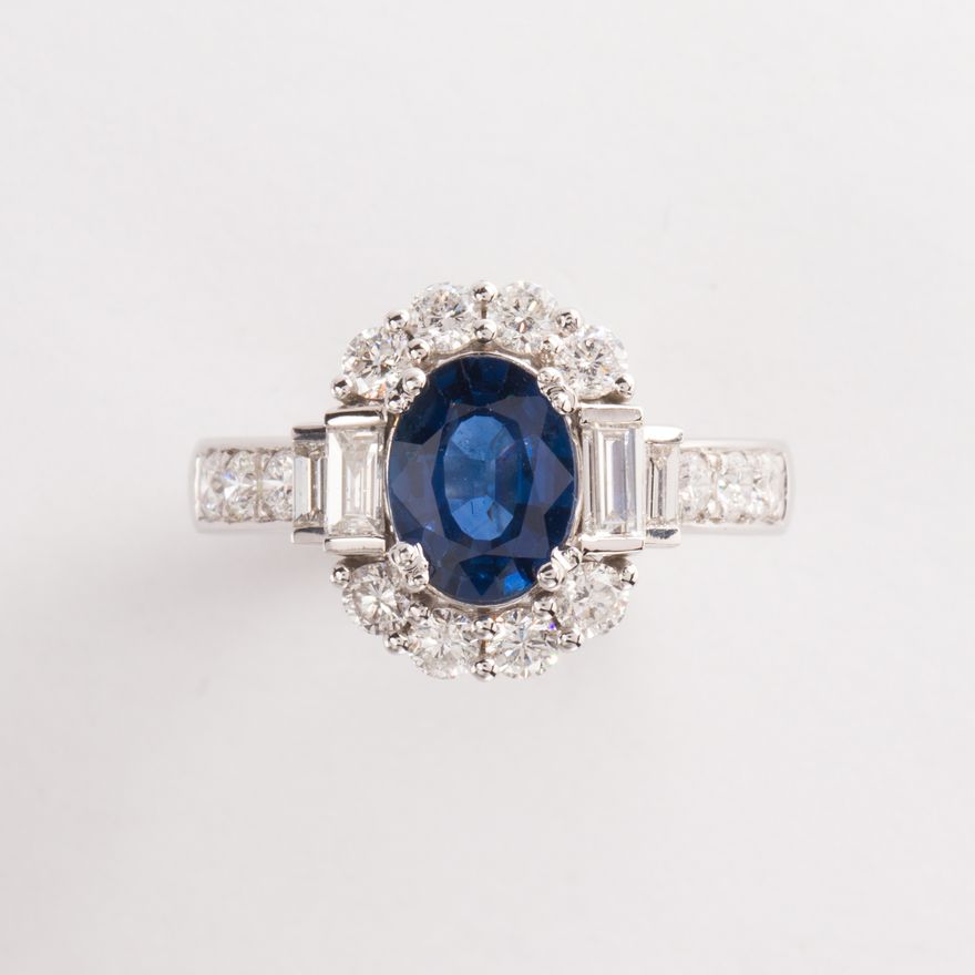 A sapphire, diamond and fourteen karat gold ring