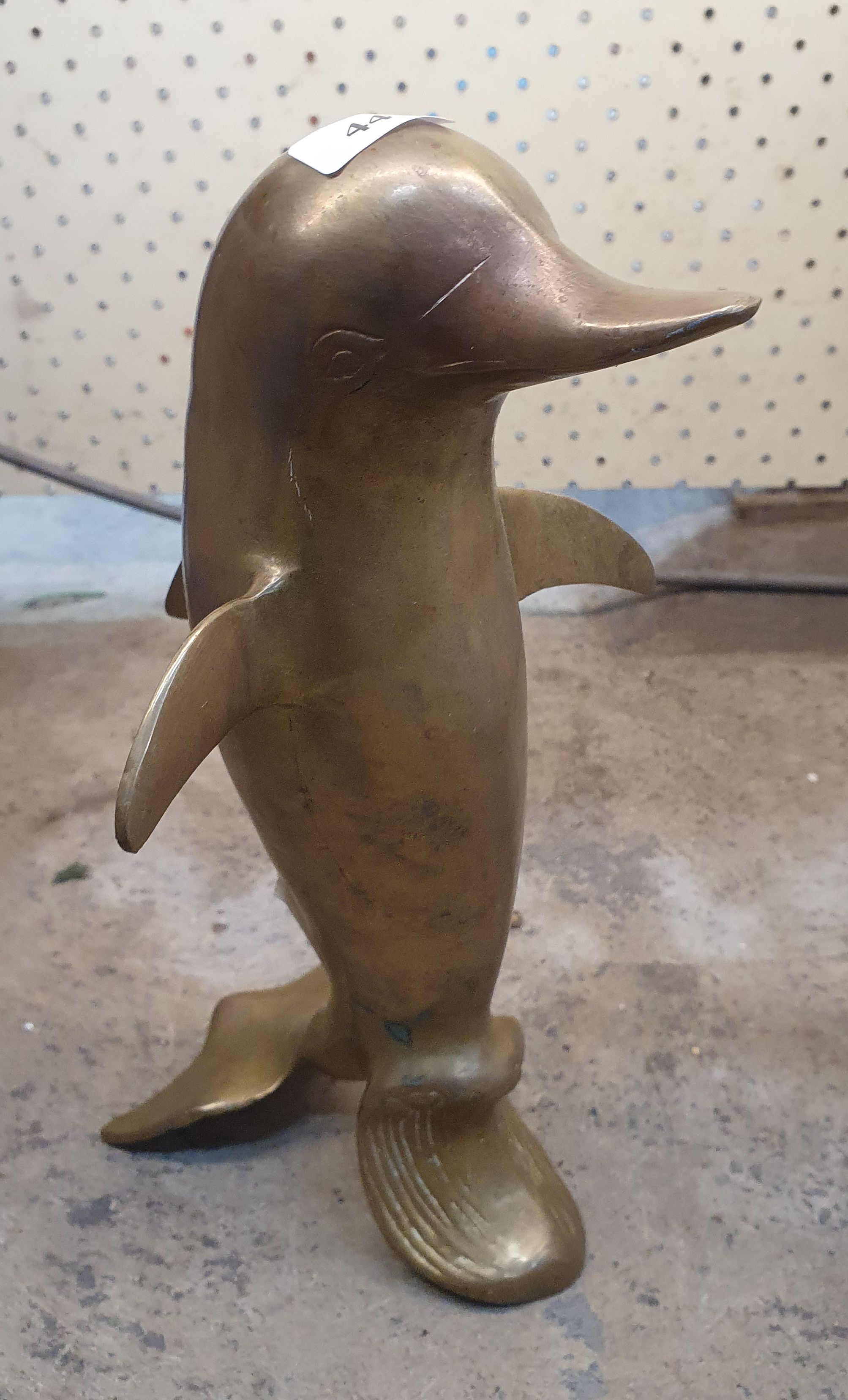 44 · A BRASS DOLPHIN FIGURE