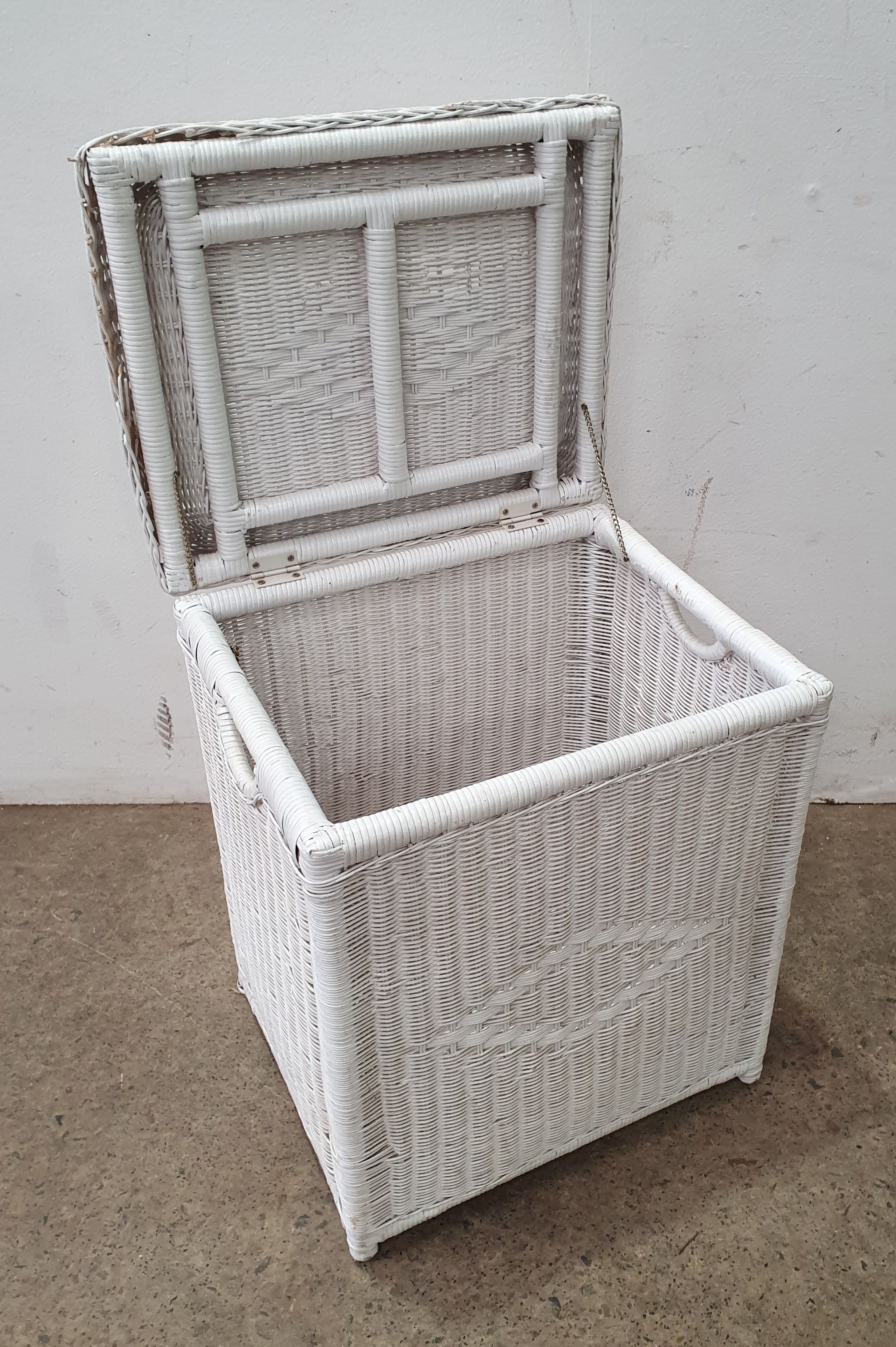 A CANE LAUNDRY HAMPER