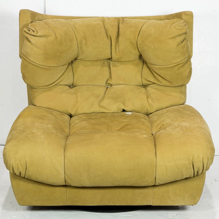 A Baxter Milano Italian leather swivel lounge chair designed by Paola Navone