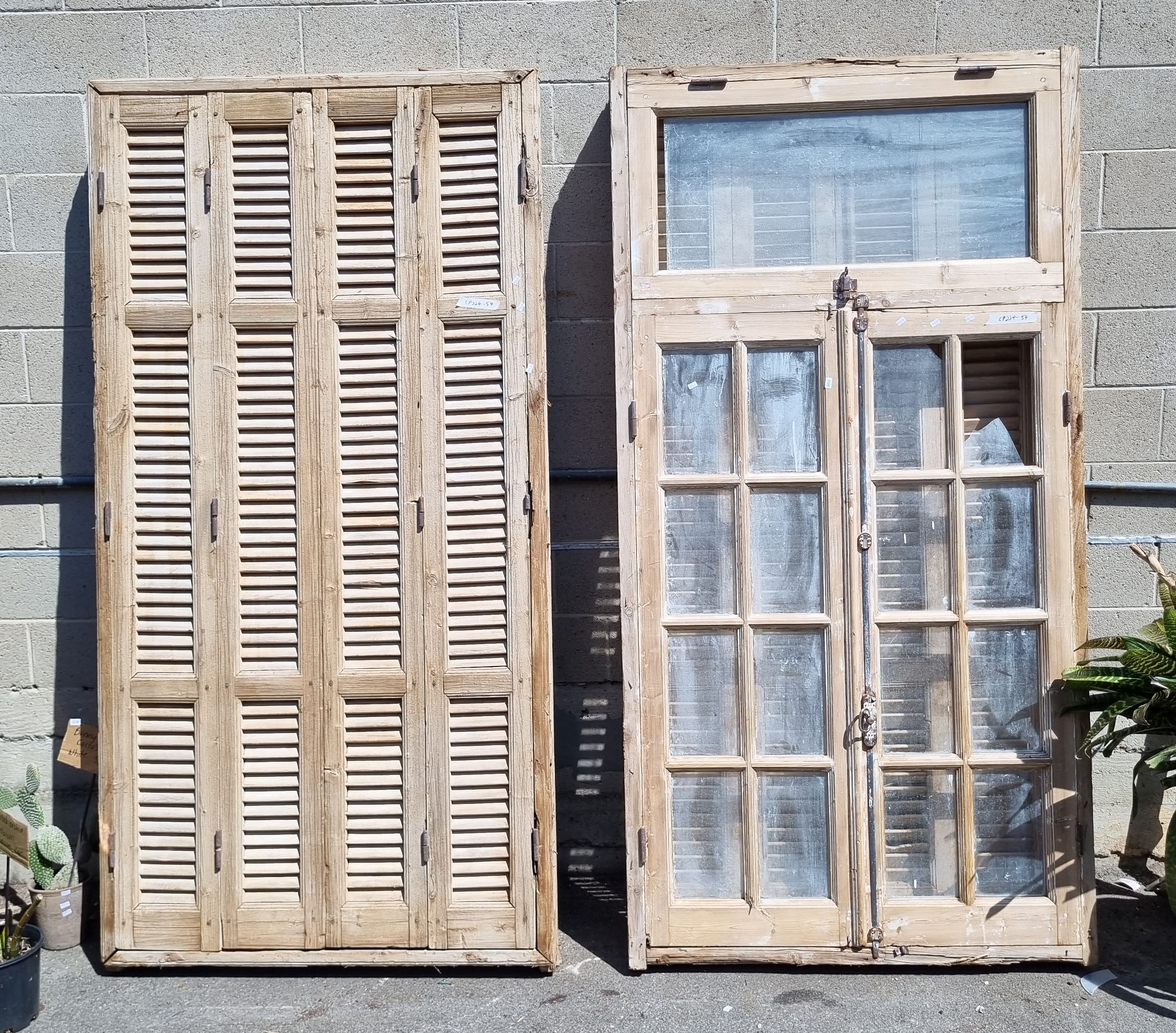 1086 · A PAIR OF LARGE RUSTIC SHUTTER WINDOWS