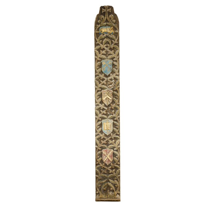 A Continental polychrome and gilt carved wood ecclesiastical panel representing the Apostle John