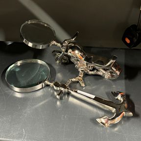 Two interesting desk magnifying glasses, largest 30cm.