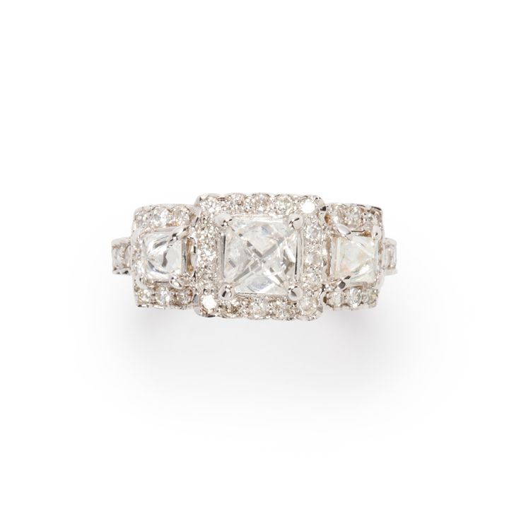 A diamond and eighteen karat white gold ring
