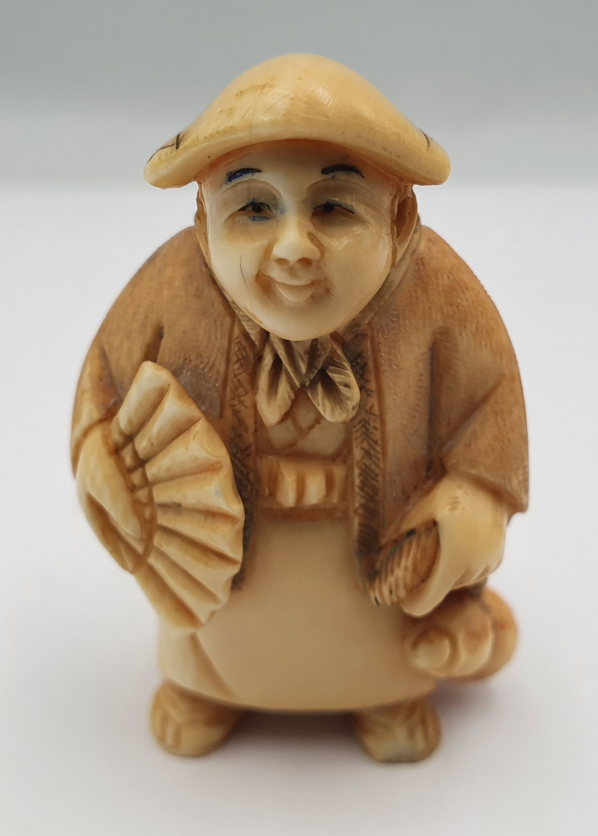 282 · A RARE DOUBLE FACE IVORY NETSUKE (SIGNED)