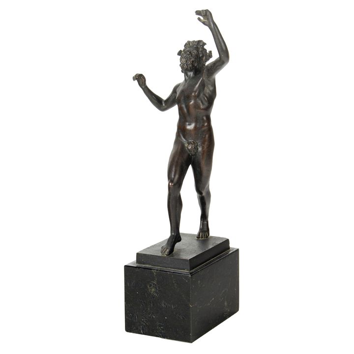 A Continental Grand Tour patinated bronze figure of the Dancing Faun