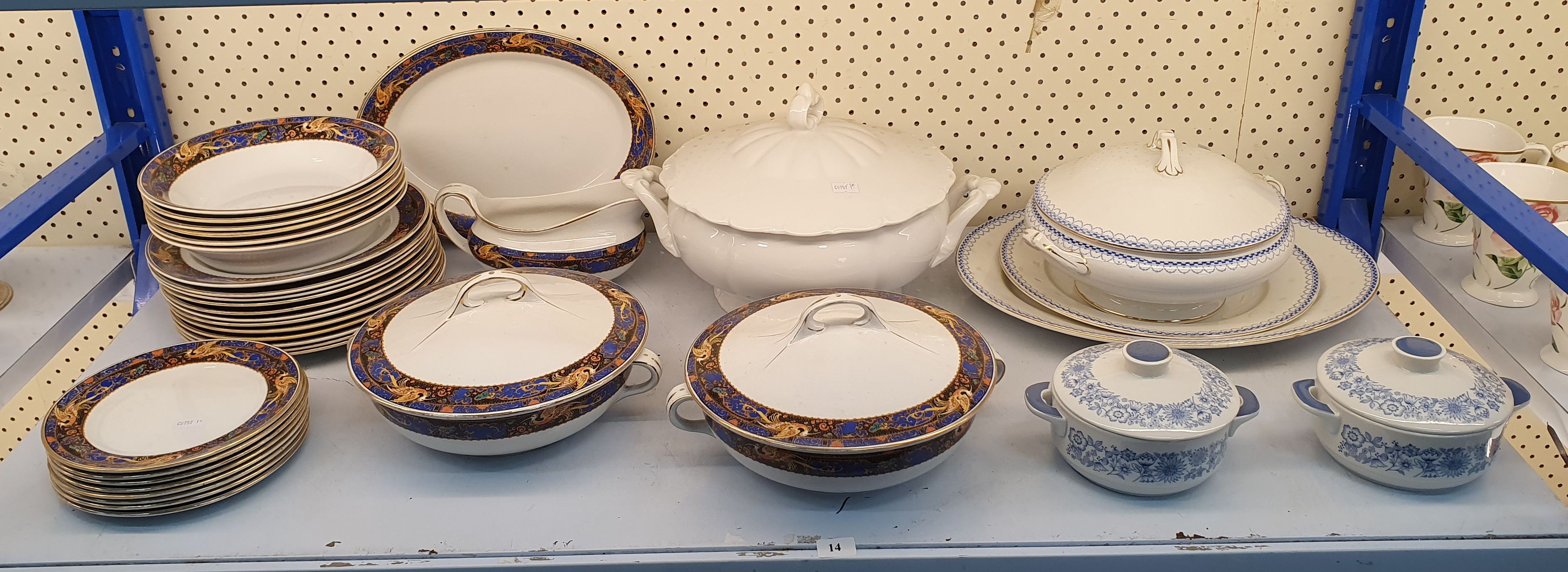 A SHELF LOT OF PLATES AND SERVING WARE