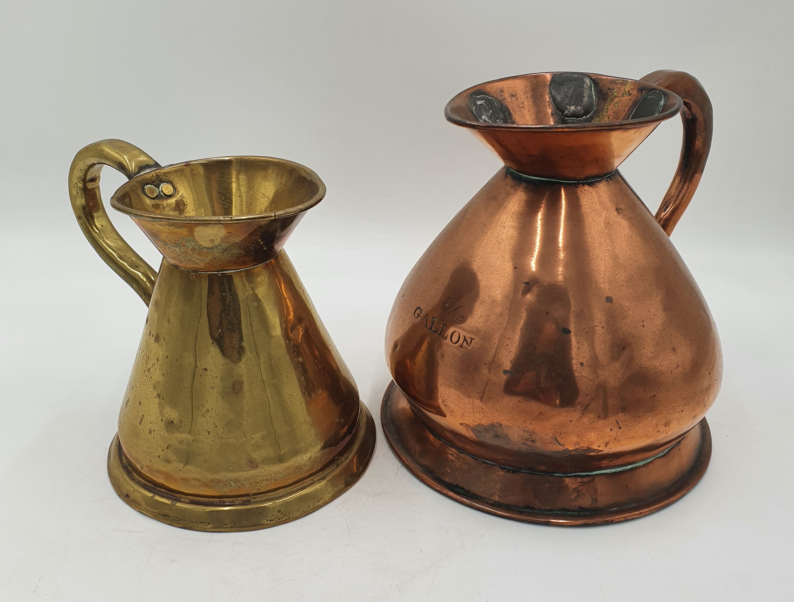 A COPPER HALF GALLON JUG
