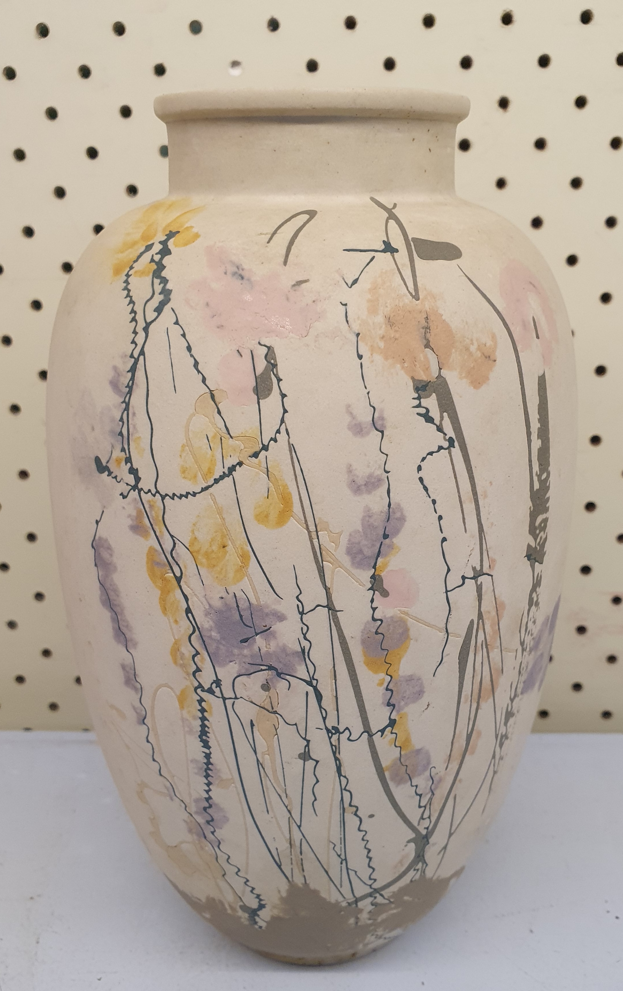 39 · A STUDIO POTTERY CREAM COLOURED VASE WITH DELICATE HANDPAINTED DECORATION