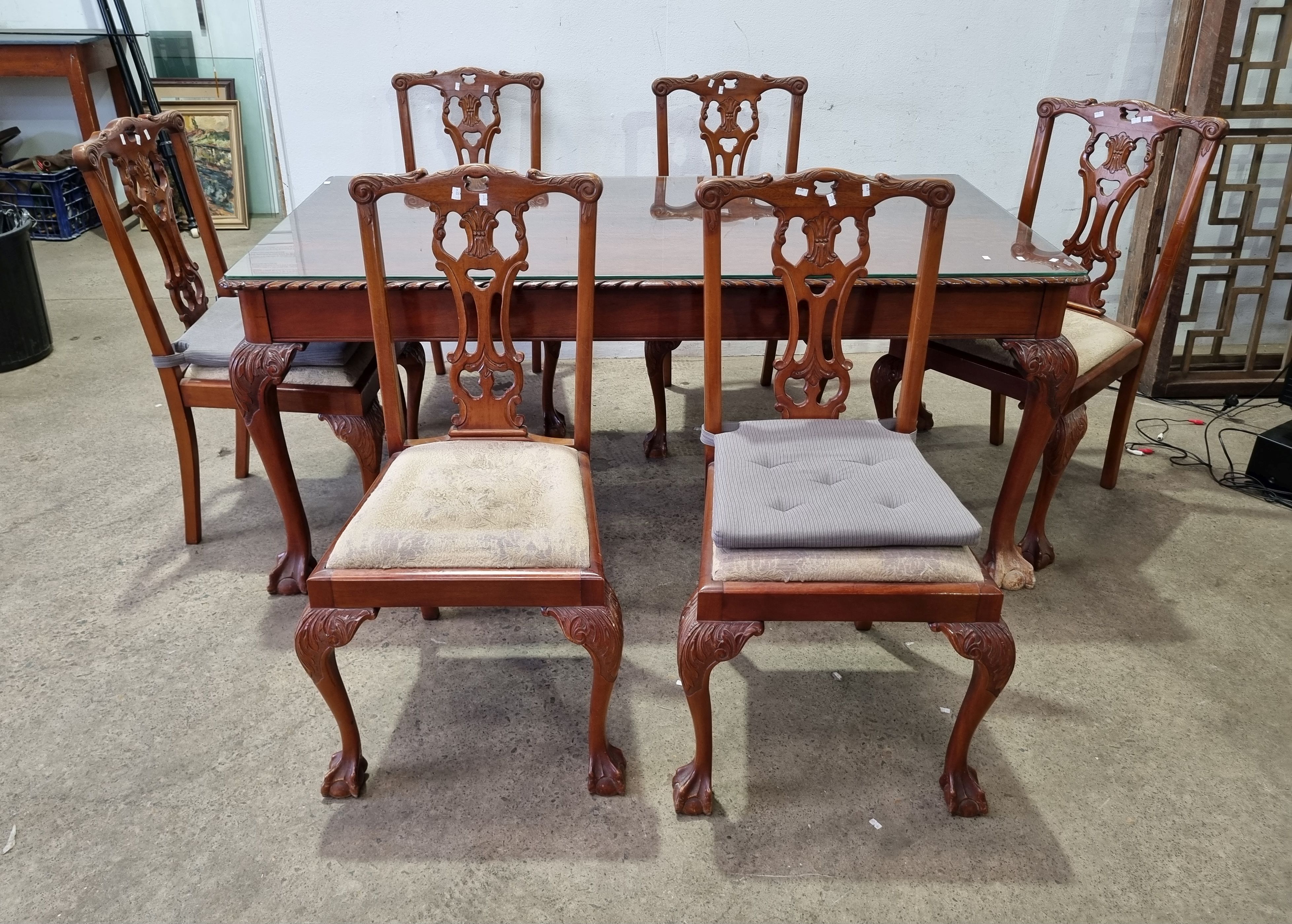 A Seven Piece Chippendale Style Dining Setting