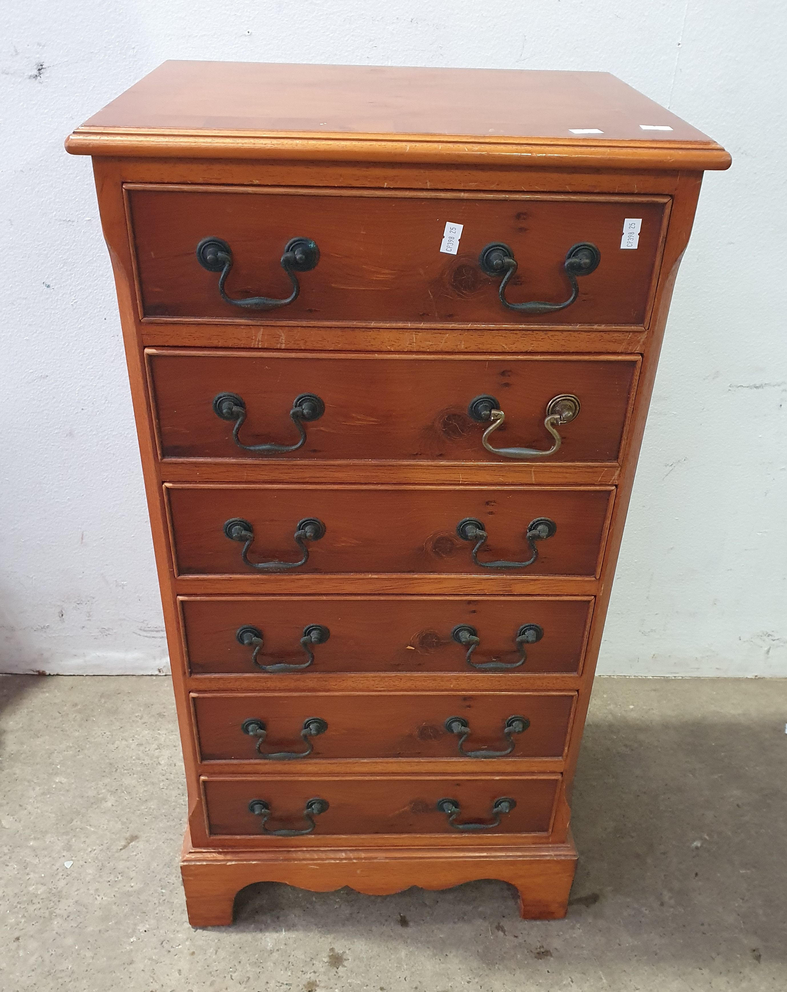 A Yew Wood Bedside Chest Of Drawers