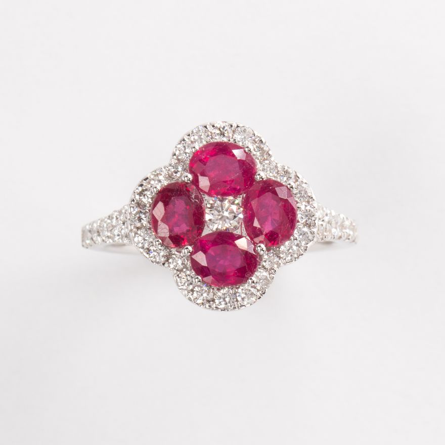A ruby, diamond and fourteen karat white gold ring