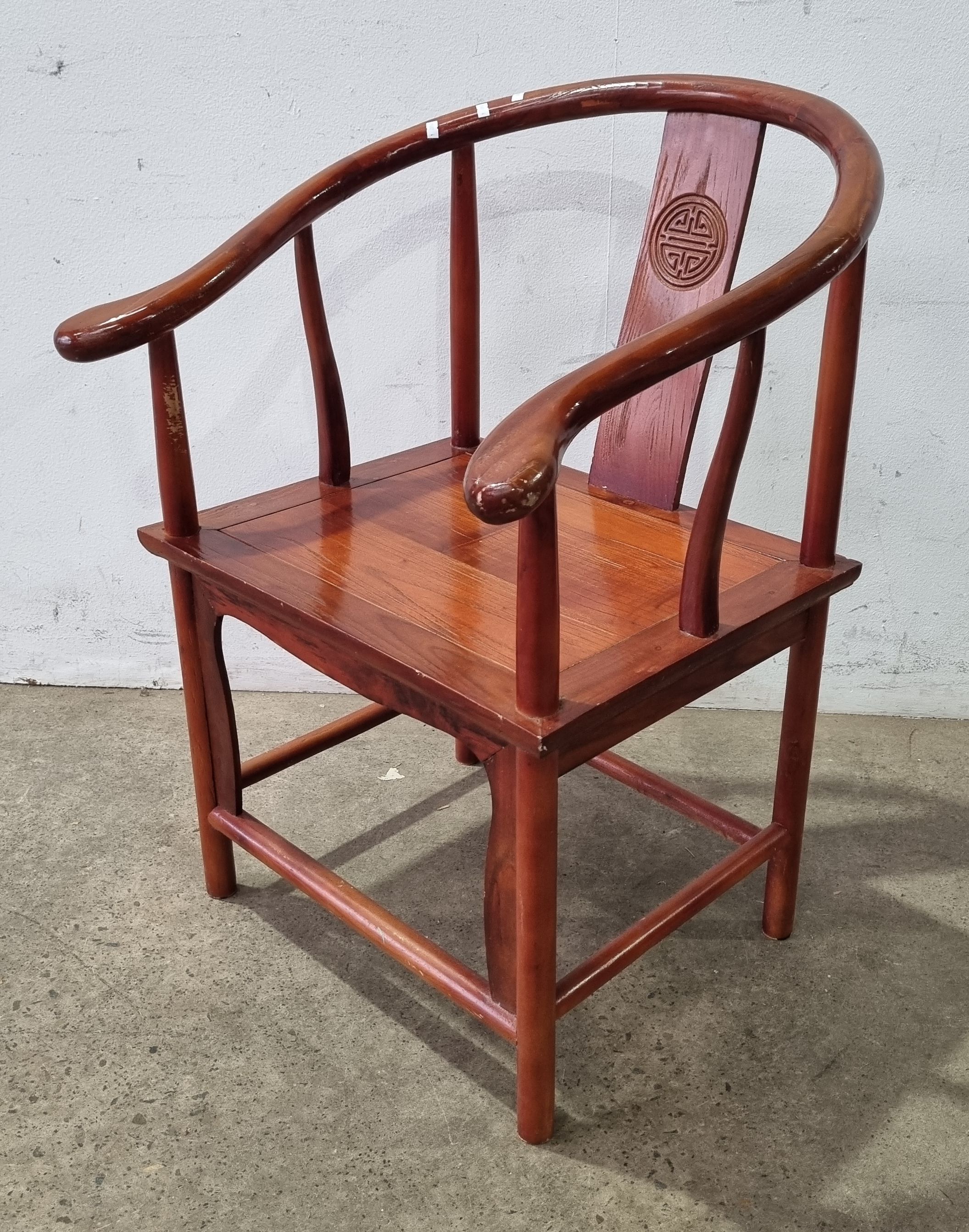 2454 · AN ASIAN TIMBER ARMCHAIR