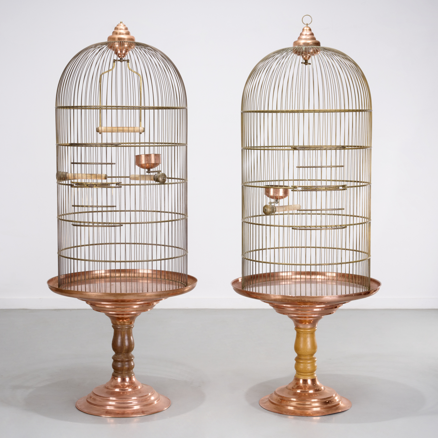 Pair oversized copper bird cages on stands