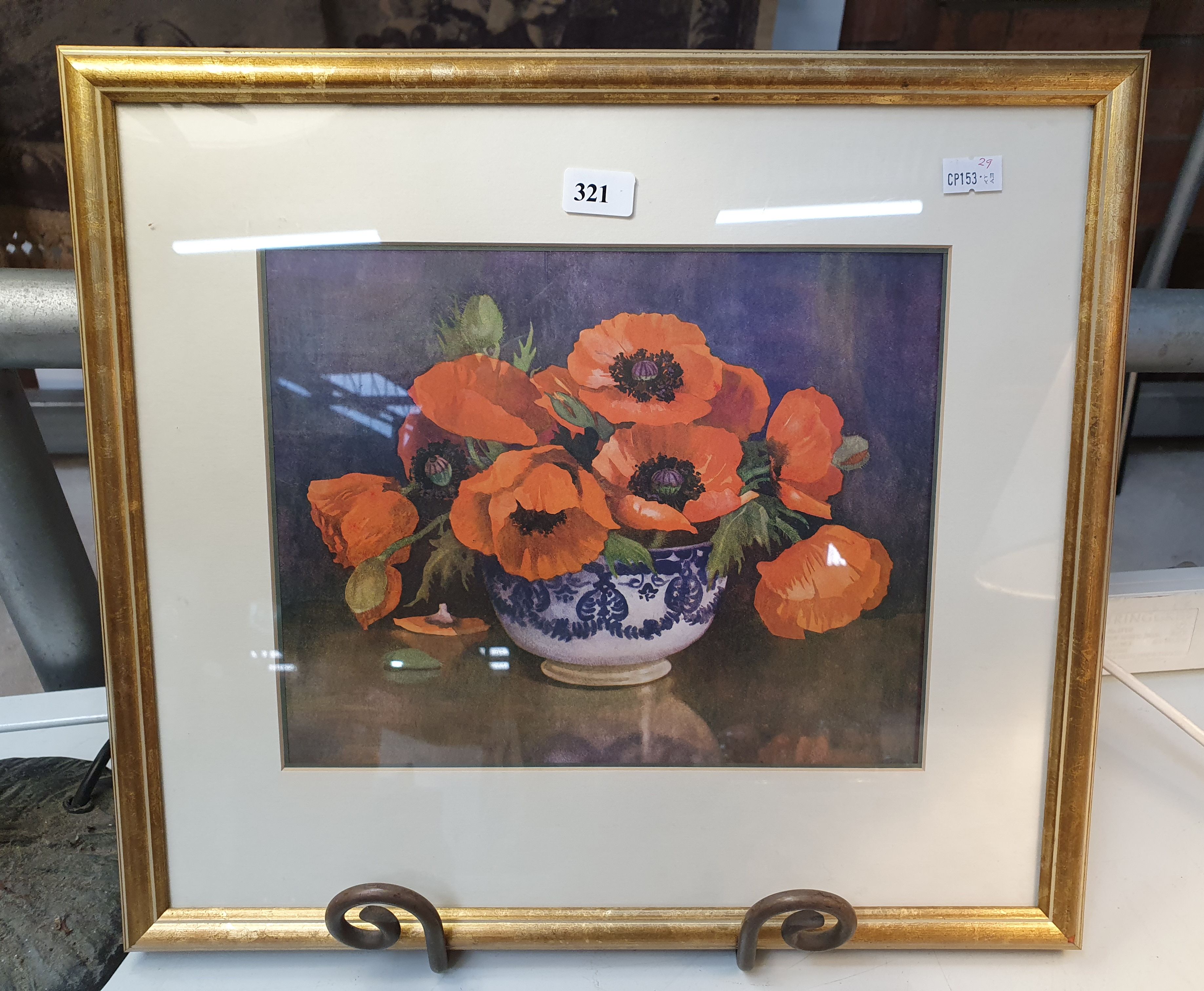 A Framed Print Of Nasturtiums In A Blue And White Bowl