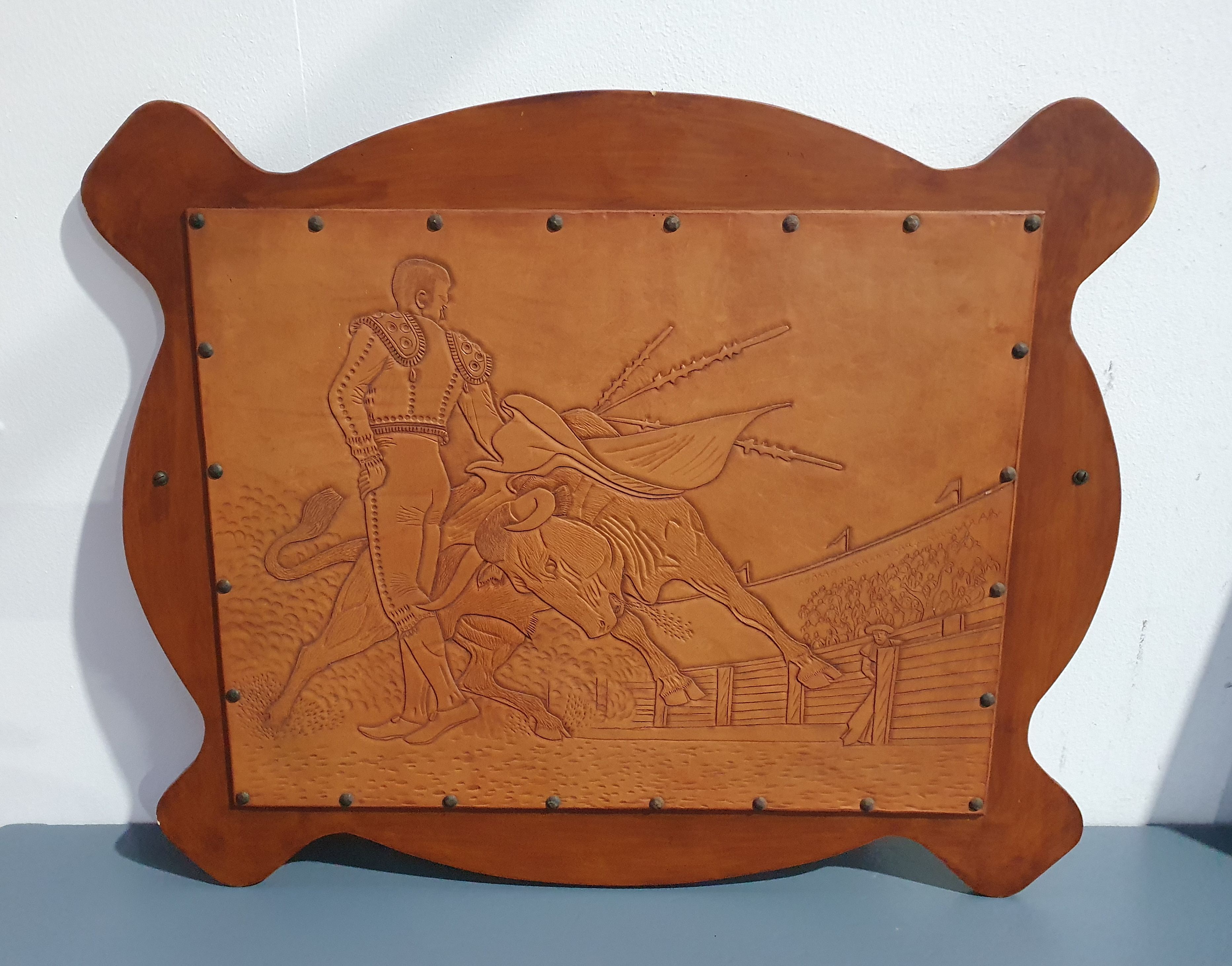 2129A · A VINTAGE LEATHER CARVED ARTWORK