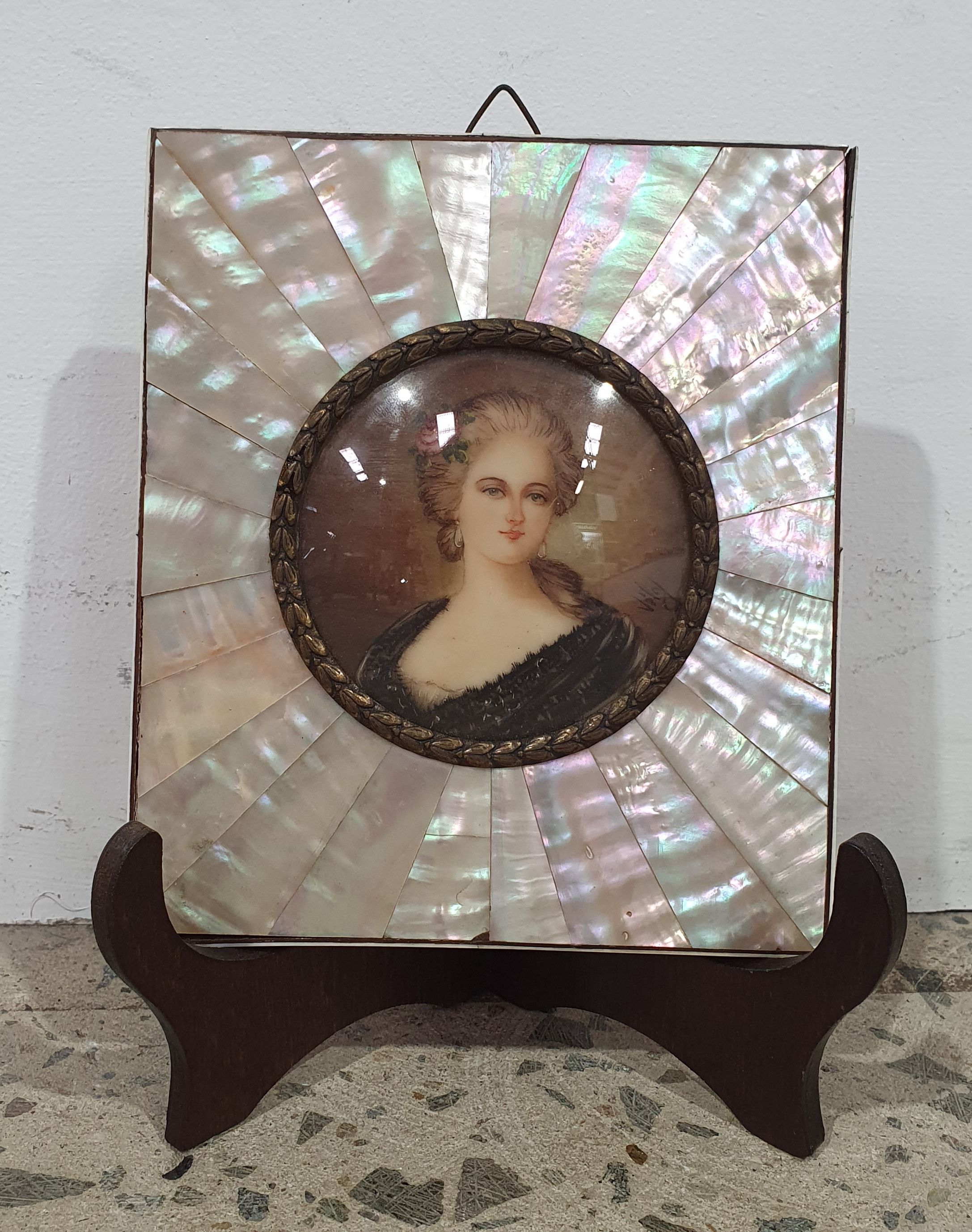 A FRENCH BELLE EPOQUE MOTHER-OF-PEARL AND GILT-METAL PORTRAIT MINIATURE