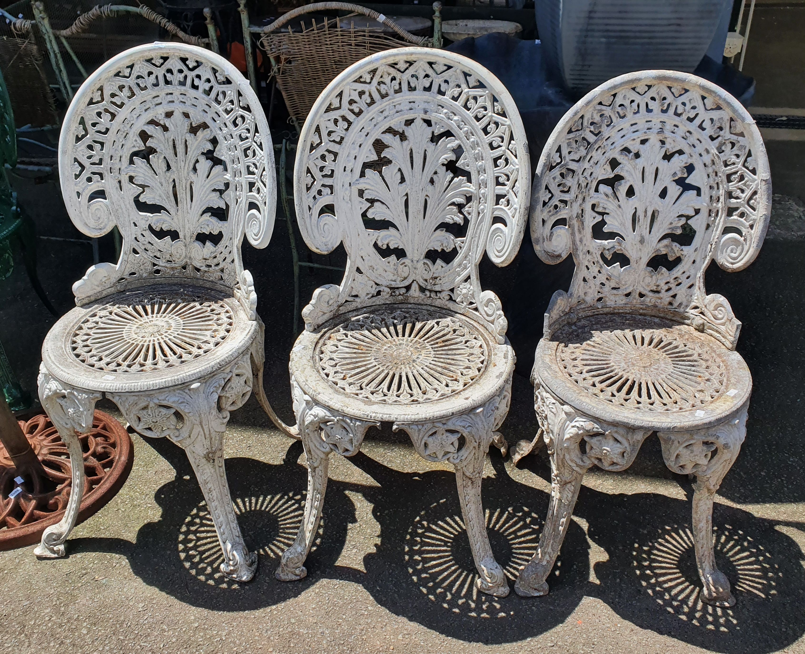 1058 · THREE CAST ALUMINIUM PATIO TABLES