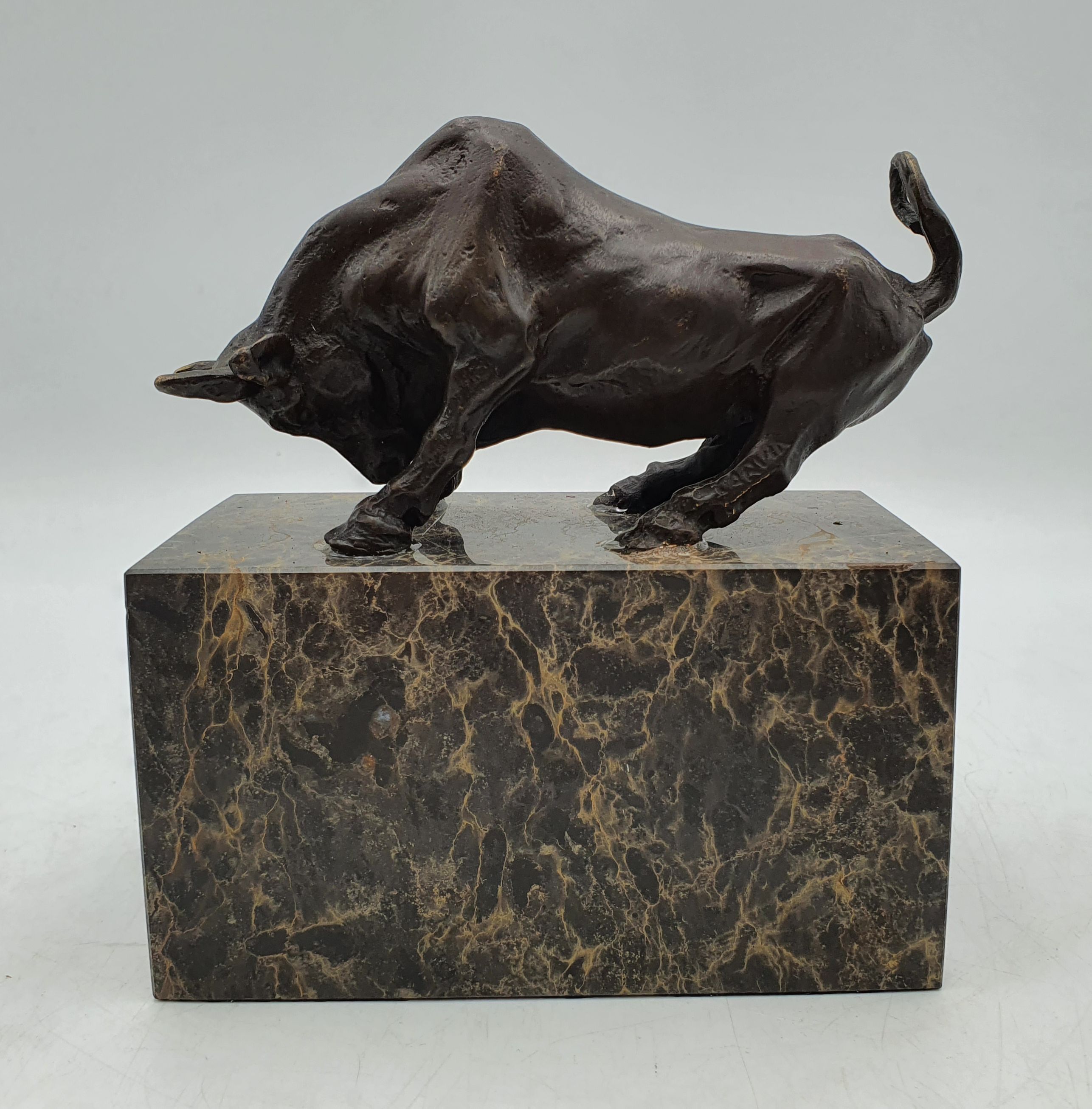 A BRONZED FIGURE OF A BULL