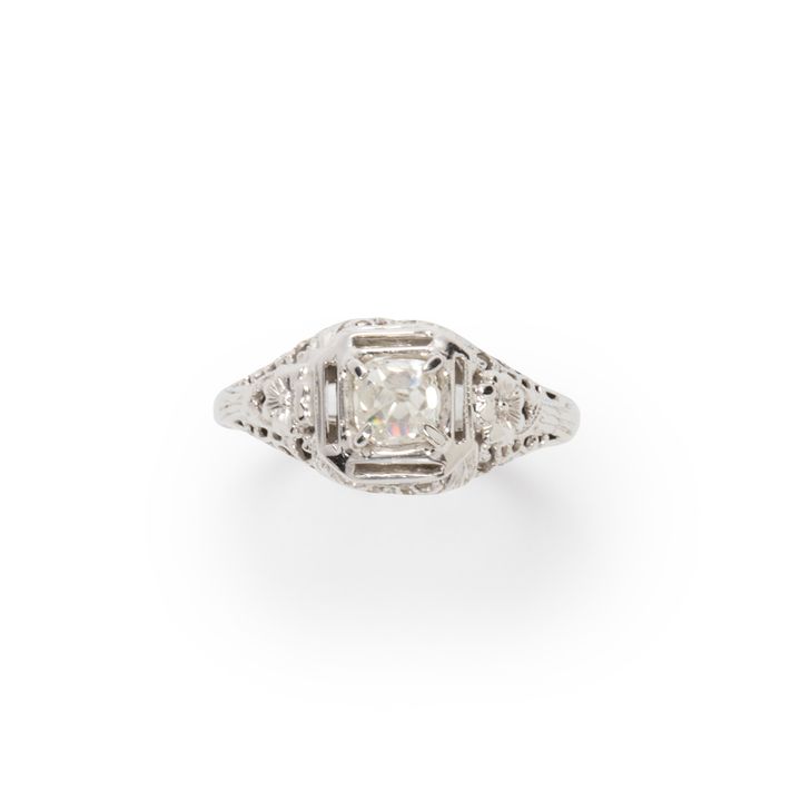 A diamond and eighteen karat white gold ring