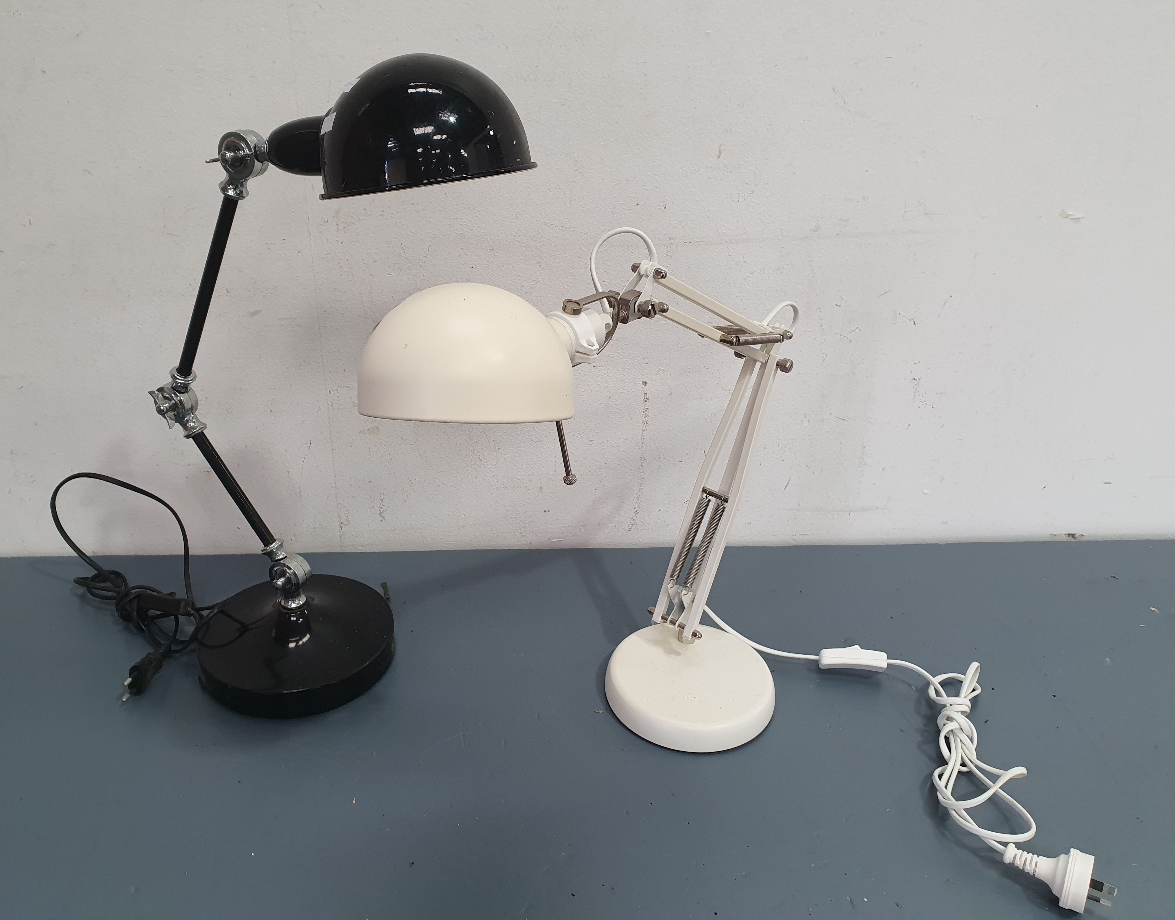 A Pair Of Adjustable Metal Desk Lamps