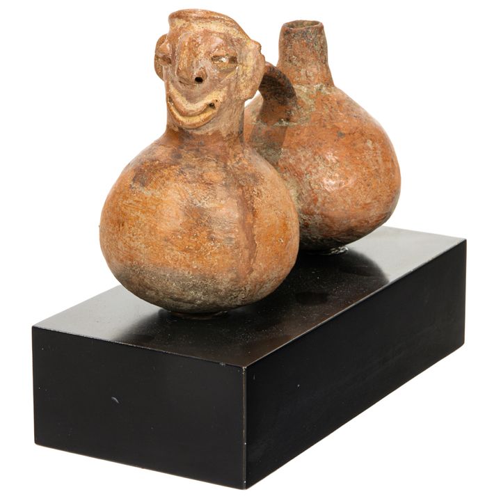A Pre Columbian Peruvian human effigy double chamber vessel, 500BC-100AD