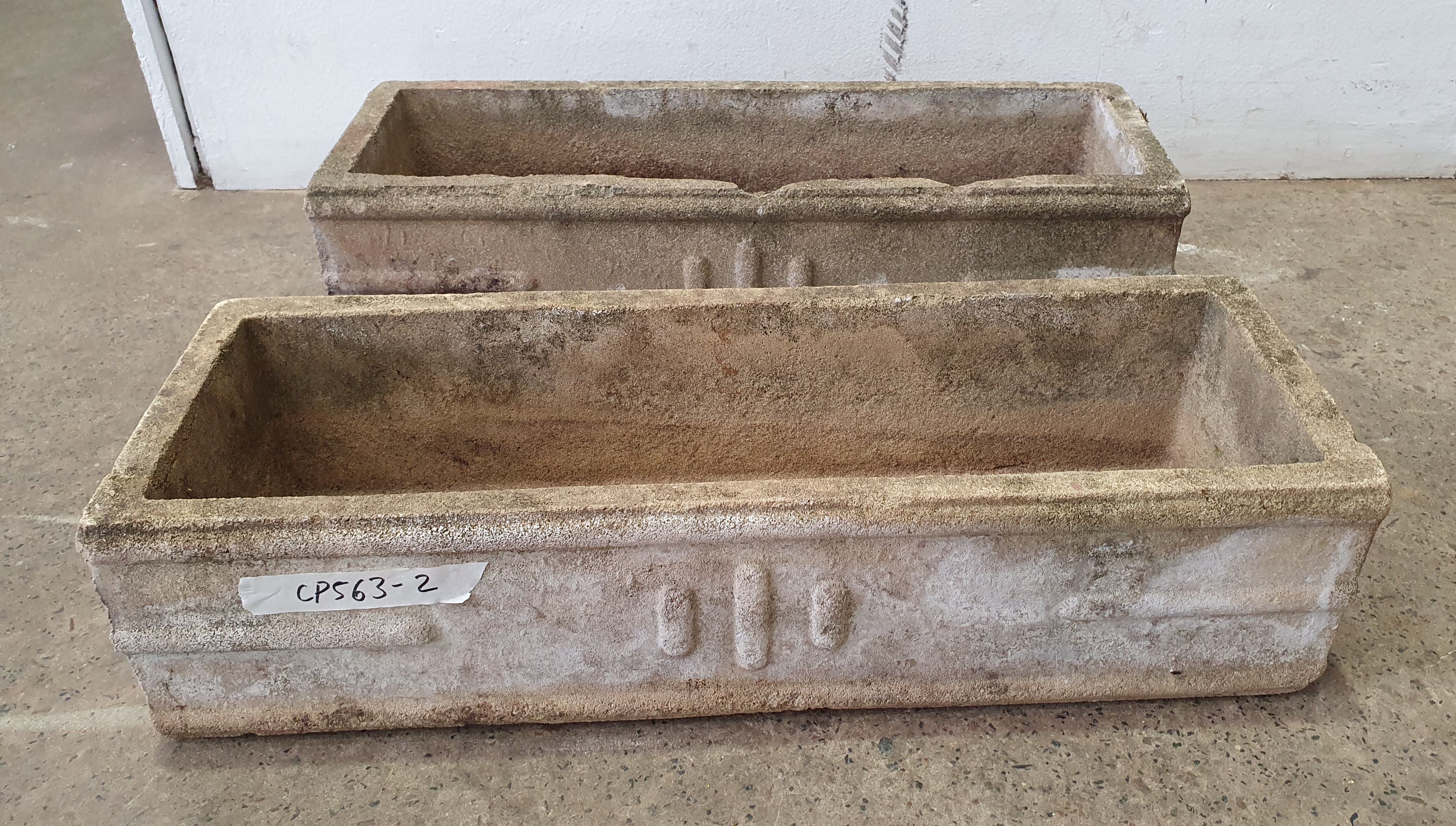 A Pair Of Concrete Planters
