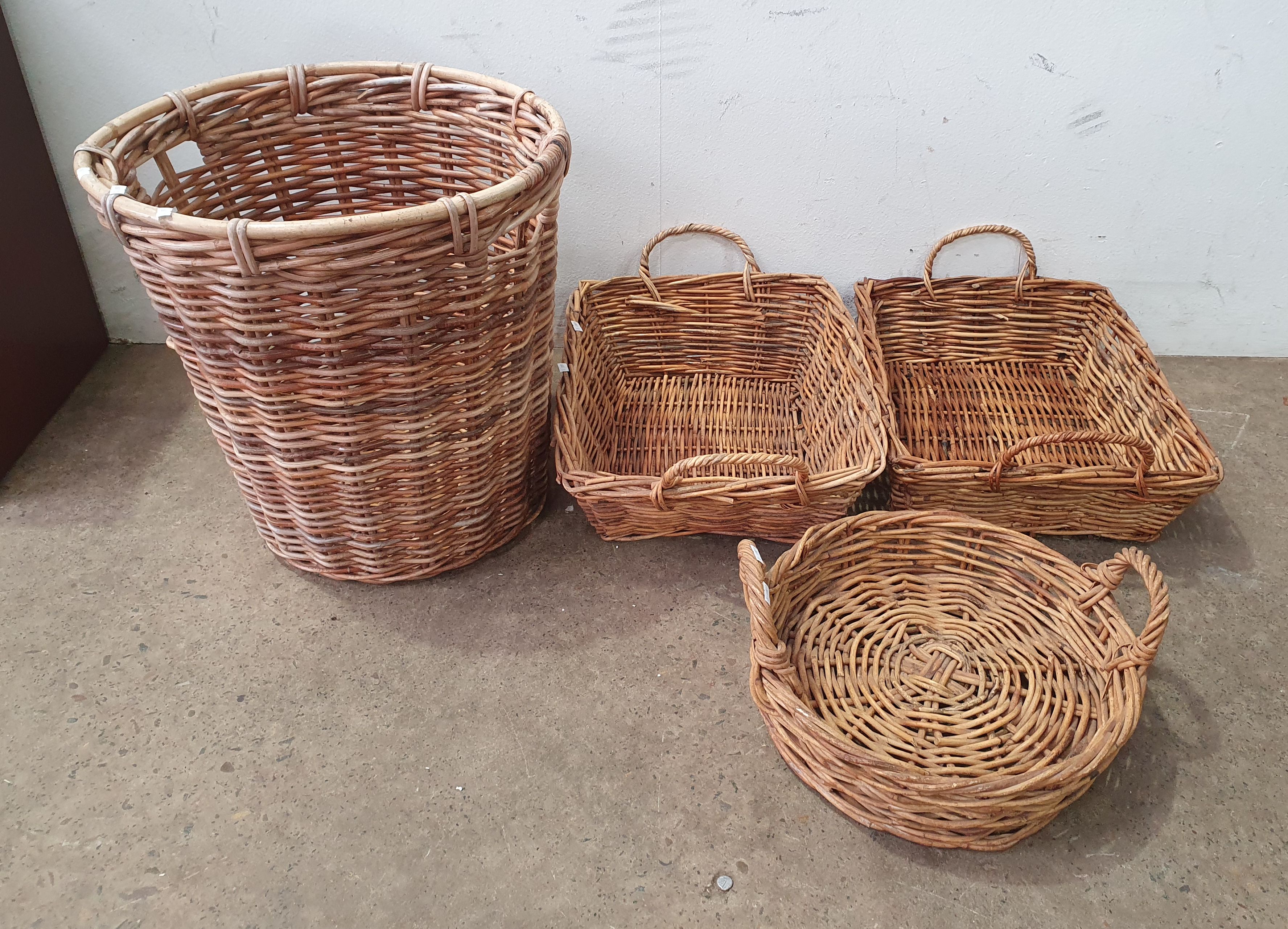 1028 · A GROUP OF FOUR WICKER BASKETS