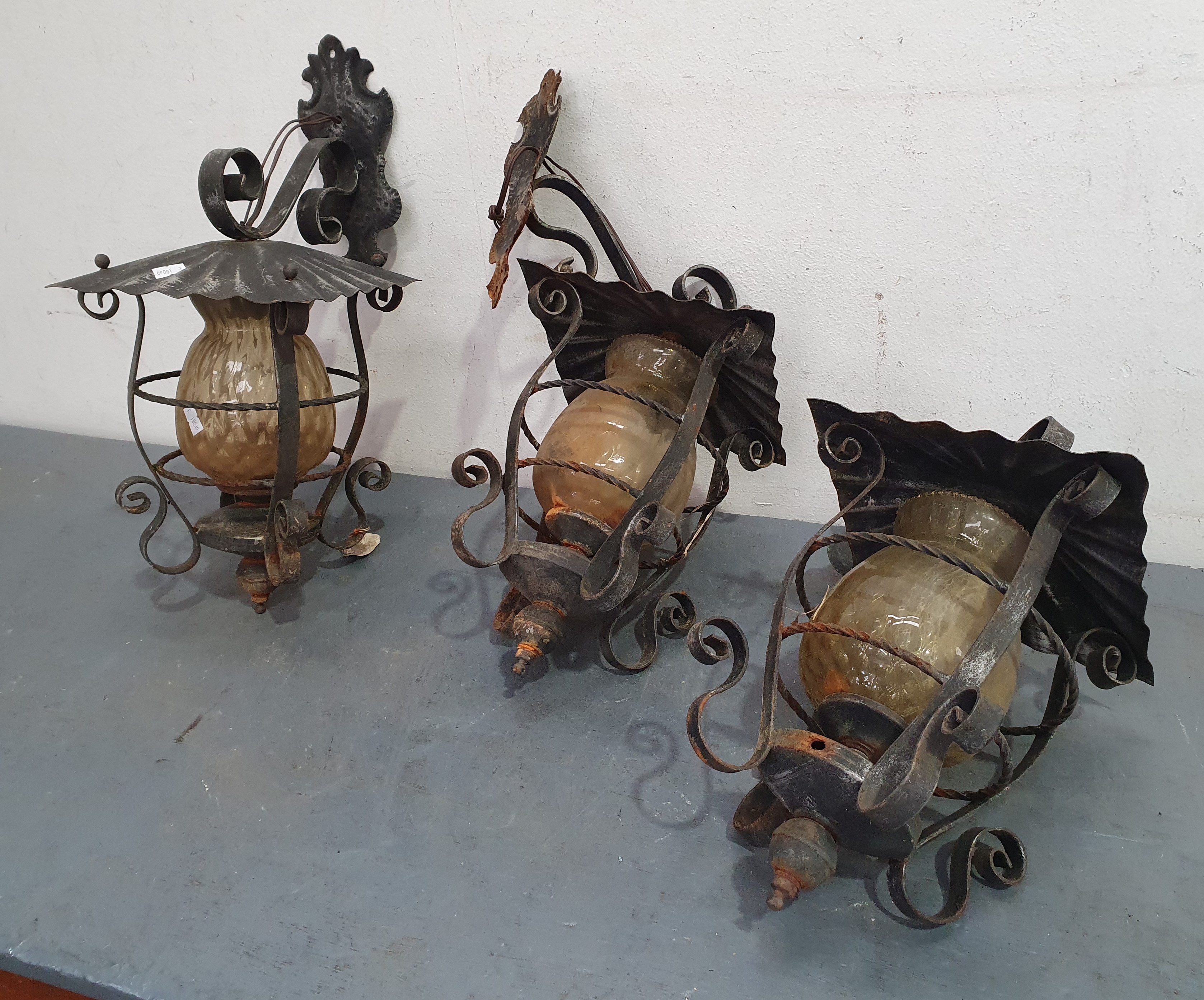 A Trio Of Metal Wall Mounted Lamps