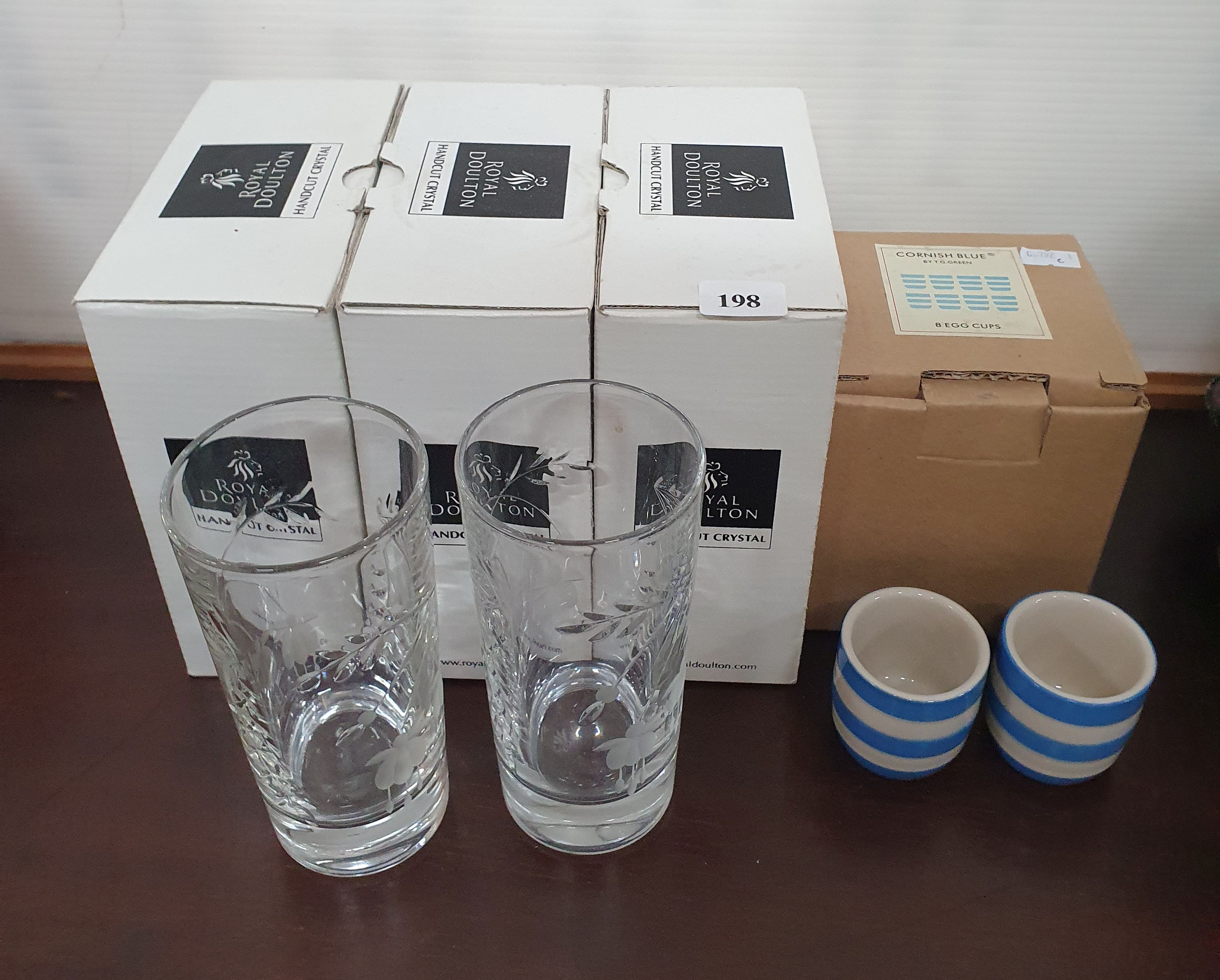 SIX ROYAL DOULTON HIGH BALL HANDCUT CRYSTAL GLASSES AND EIGHT CORNISH BLUE EGG CUPS