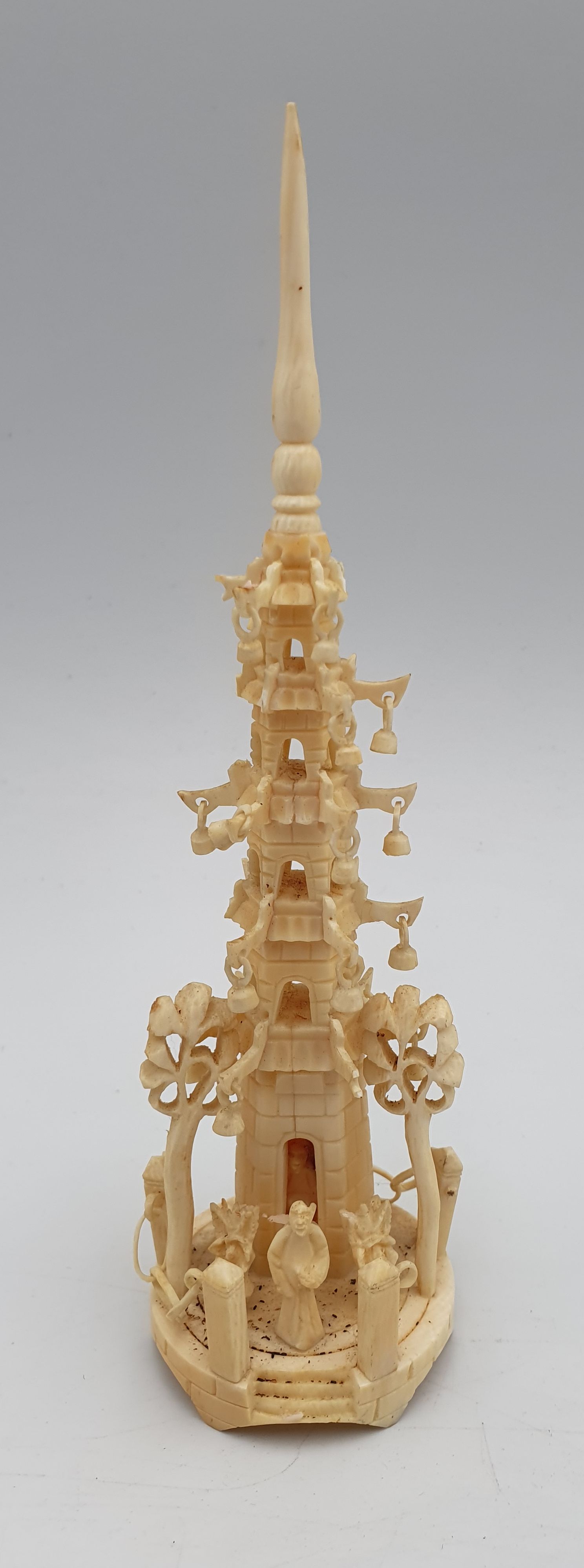 391 · A VINTAGE CARVED IVORY PAGODA
