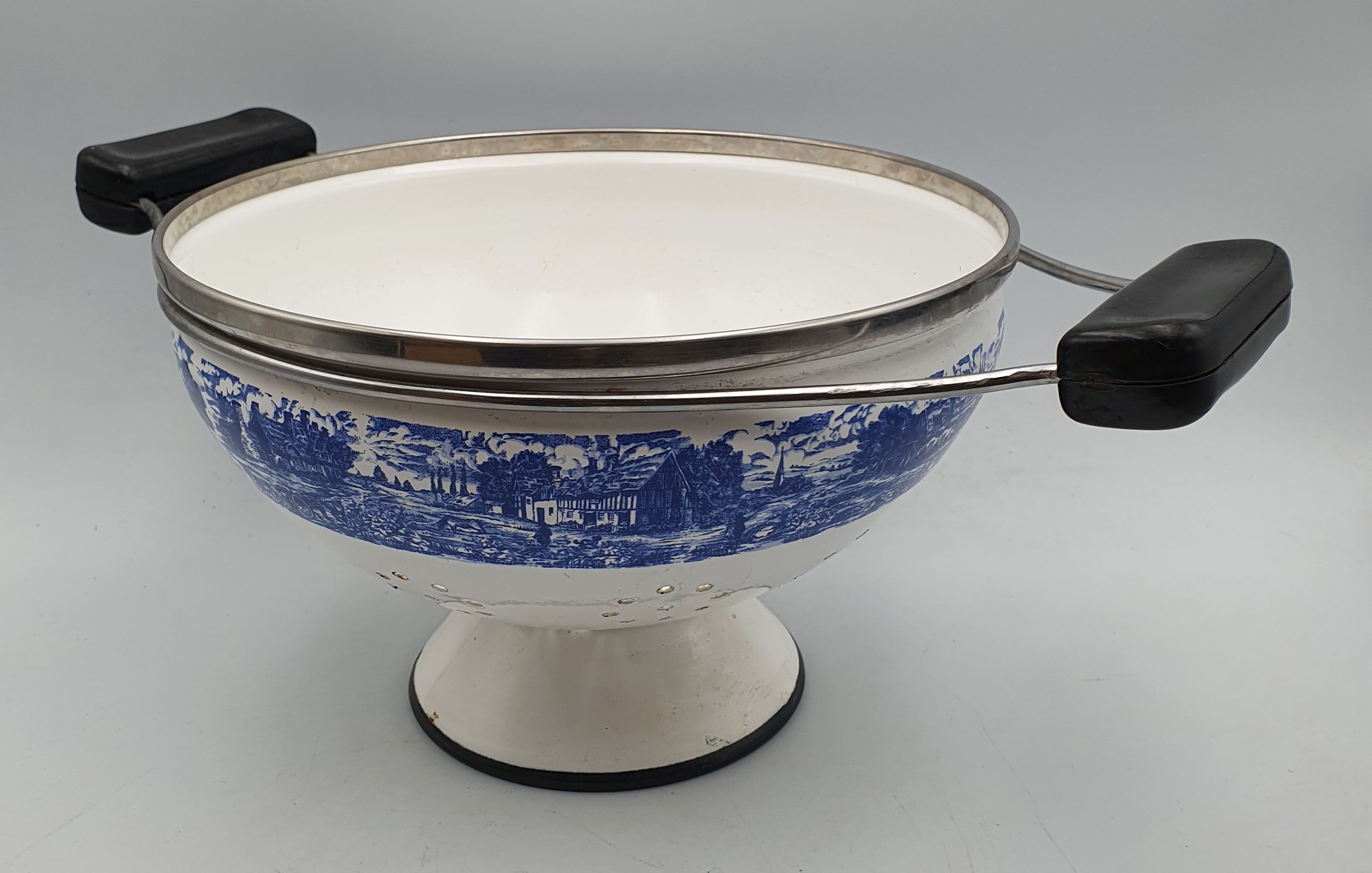 93 · AN EARLY DUTCH ENAMELLED COLANDER