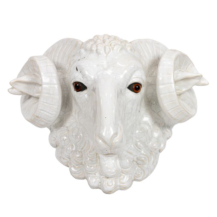 A large Continental majolica ram's head with glass inset eyes