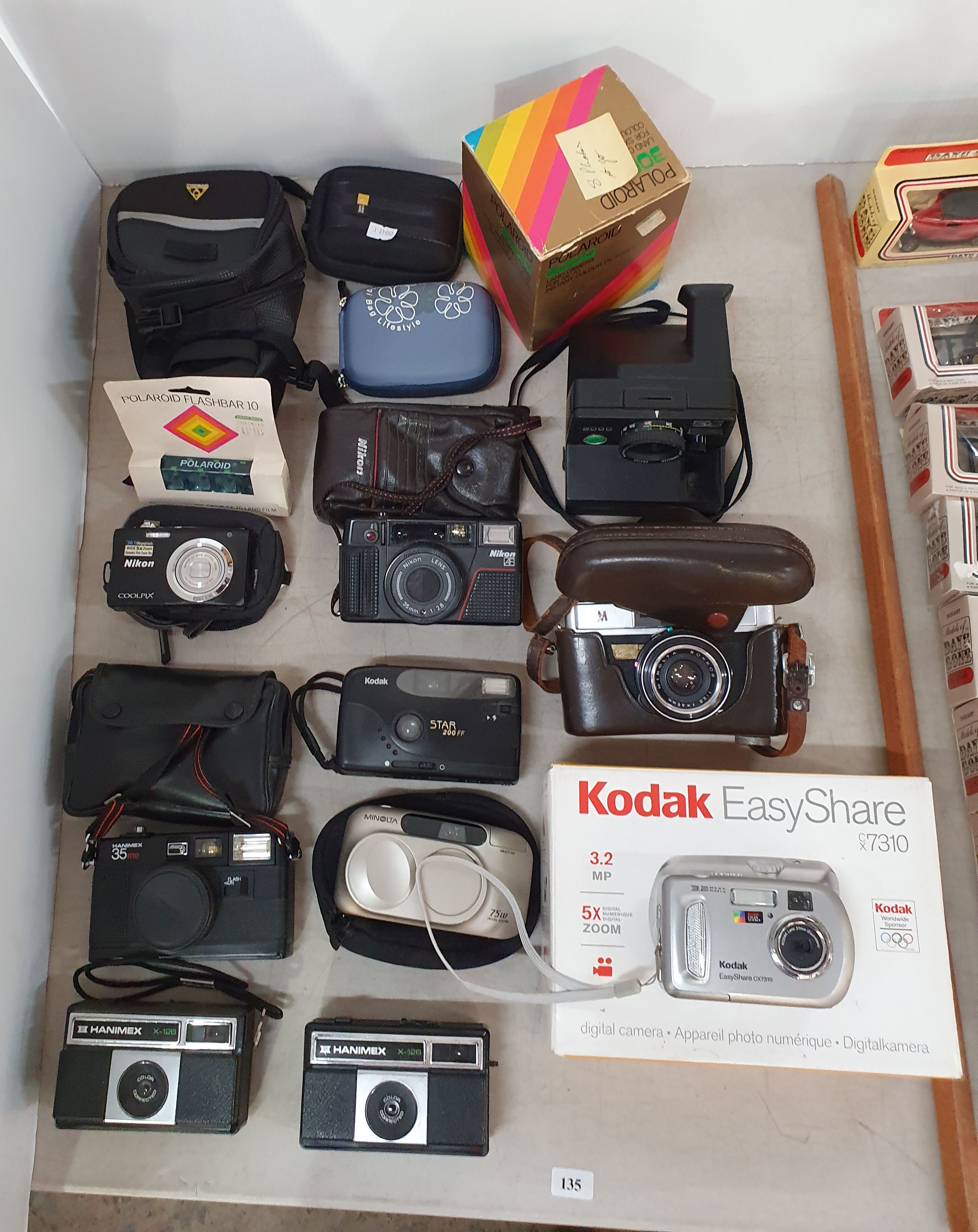 135 · A GROUP OF VARIOUS CAMERAS