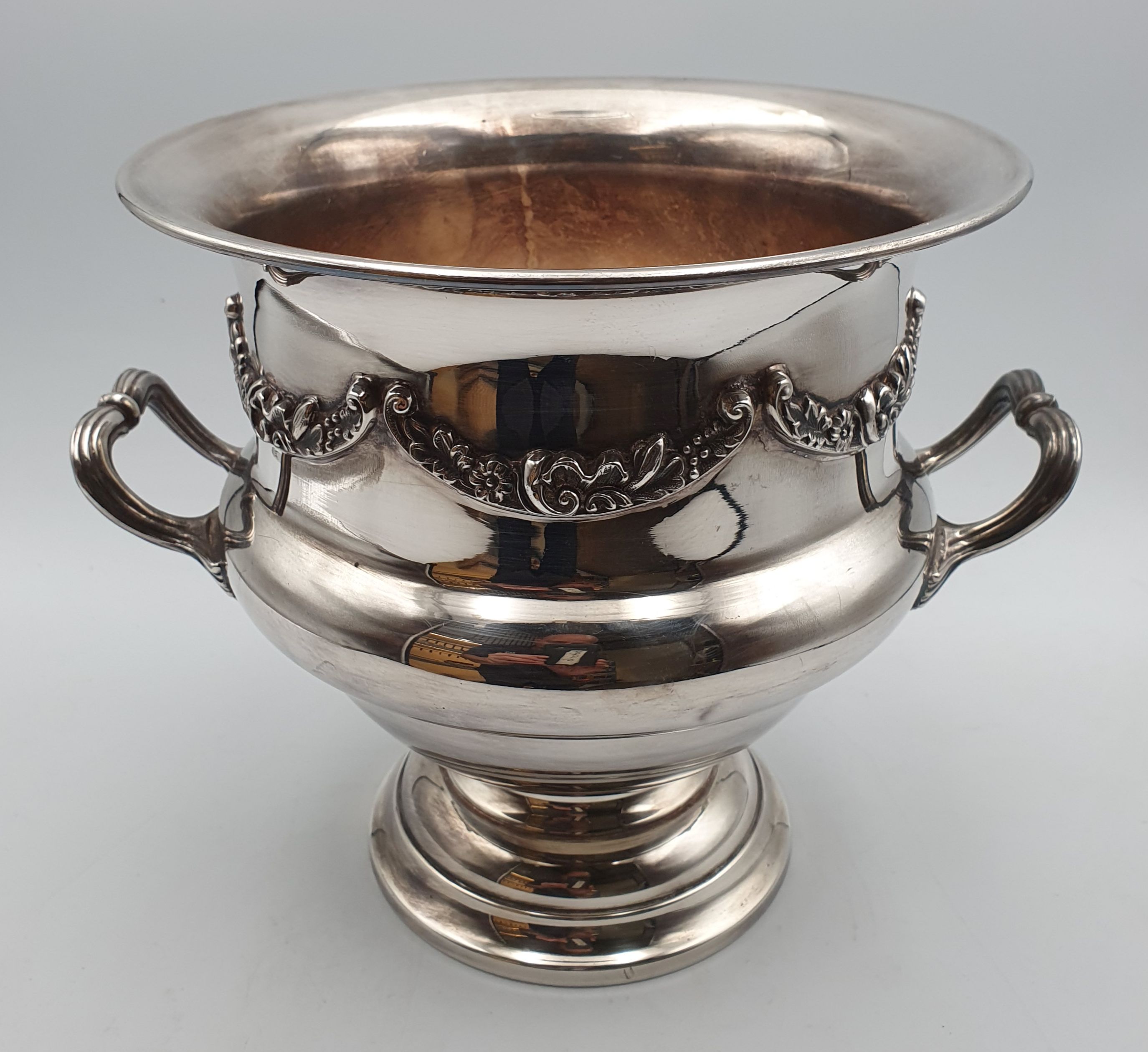 98 · AN ENGLISH HAND-CHASED SILVERPLATED CHAMPAGNE BUCKET