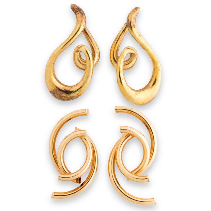 A group of fourteen karat gold earrings
