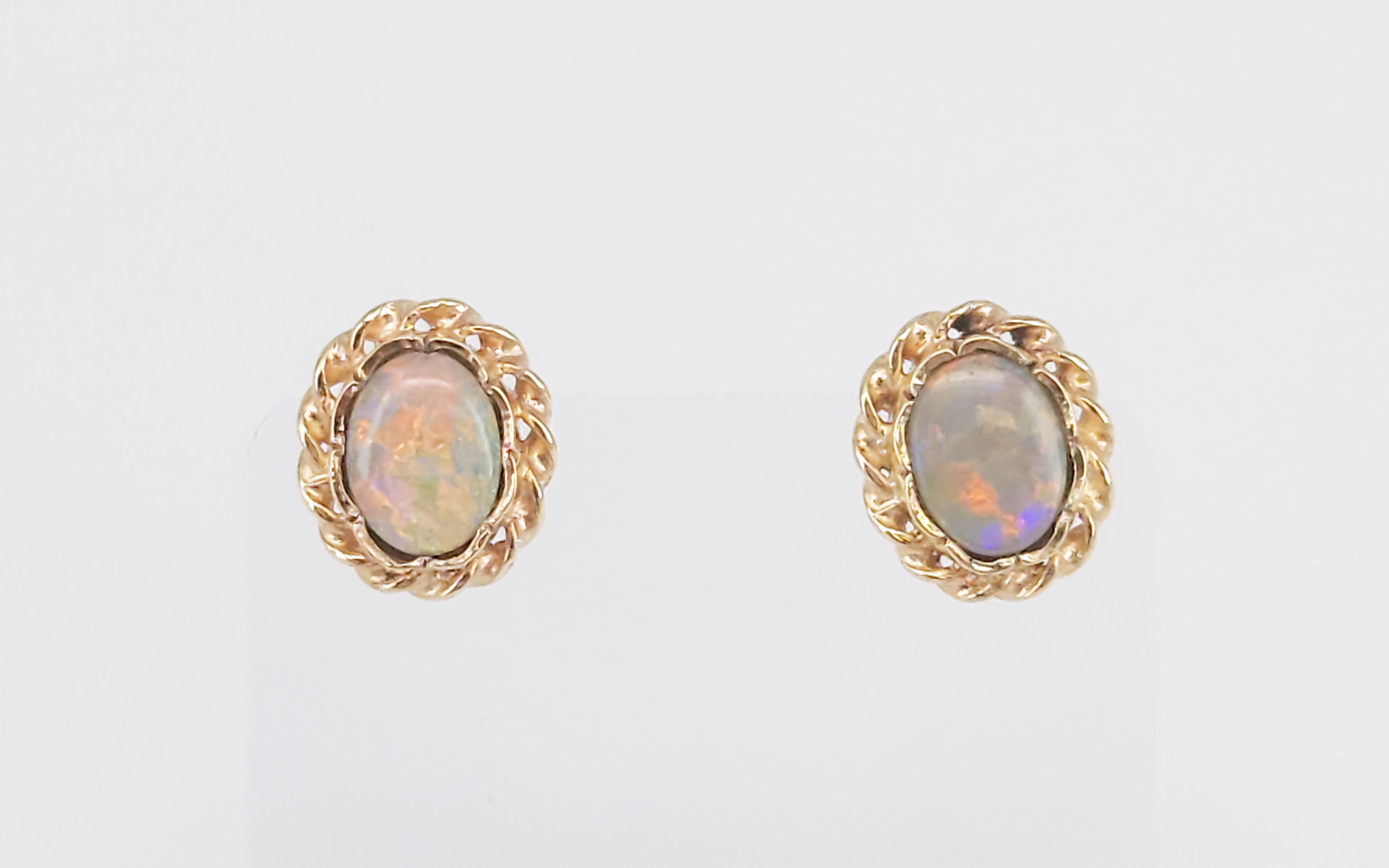 A Pair Of 9ct Yellow Gold And Black Opal Stud Earrings