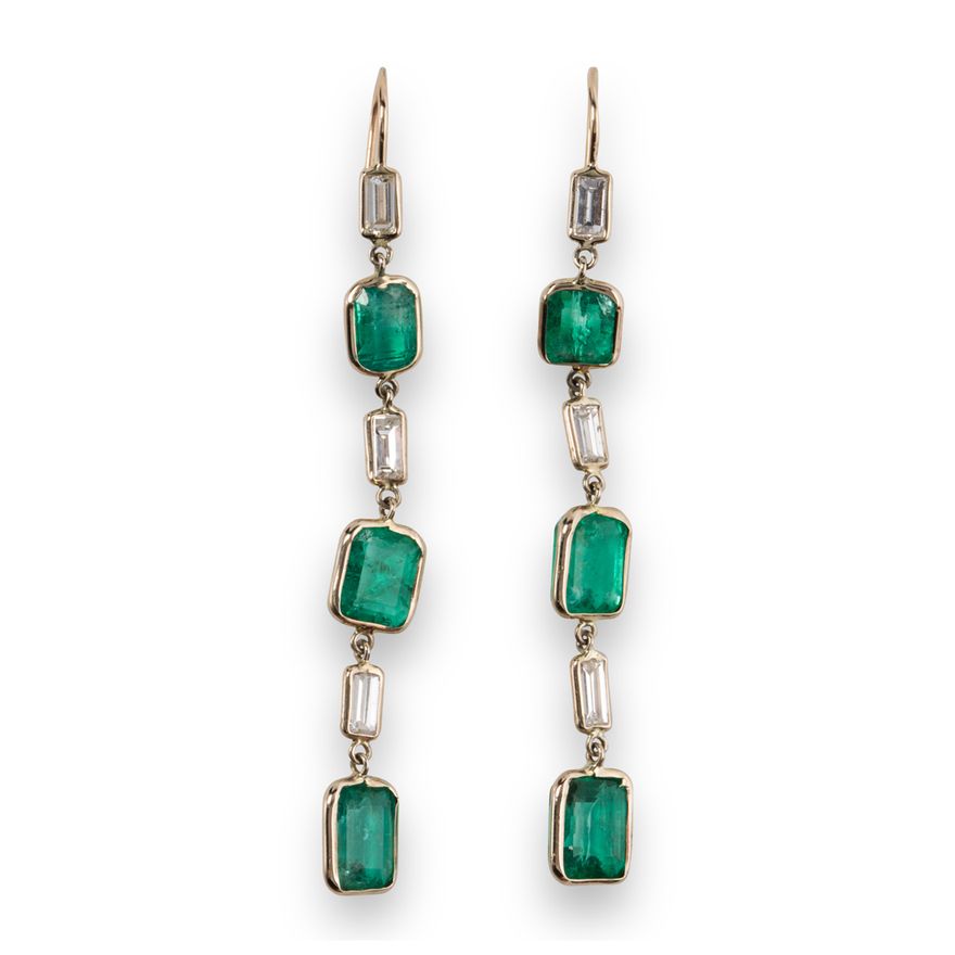 A pair of emerald, diamond and fourteen karat white gold earrings