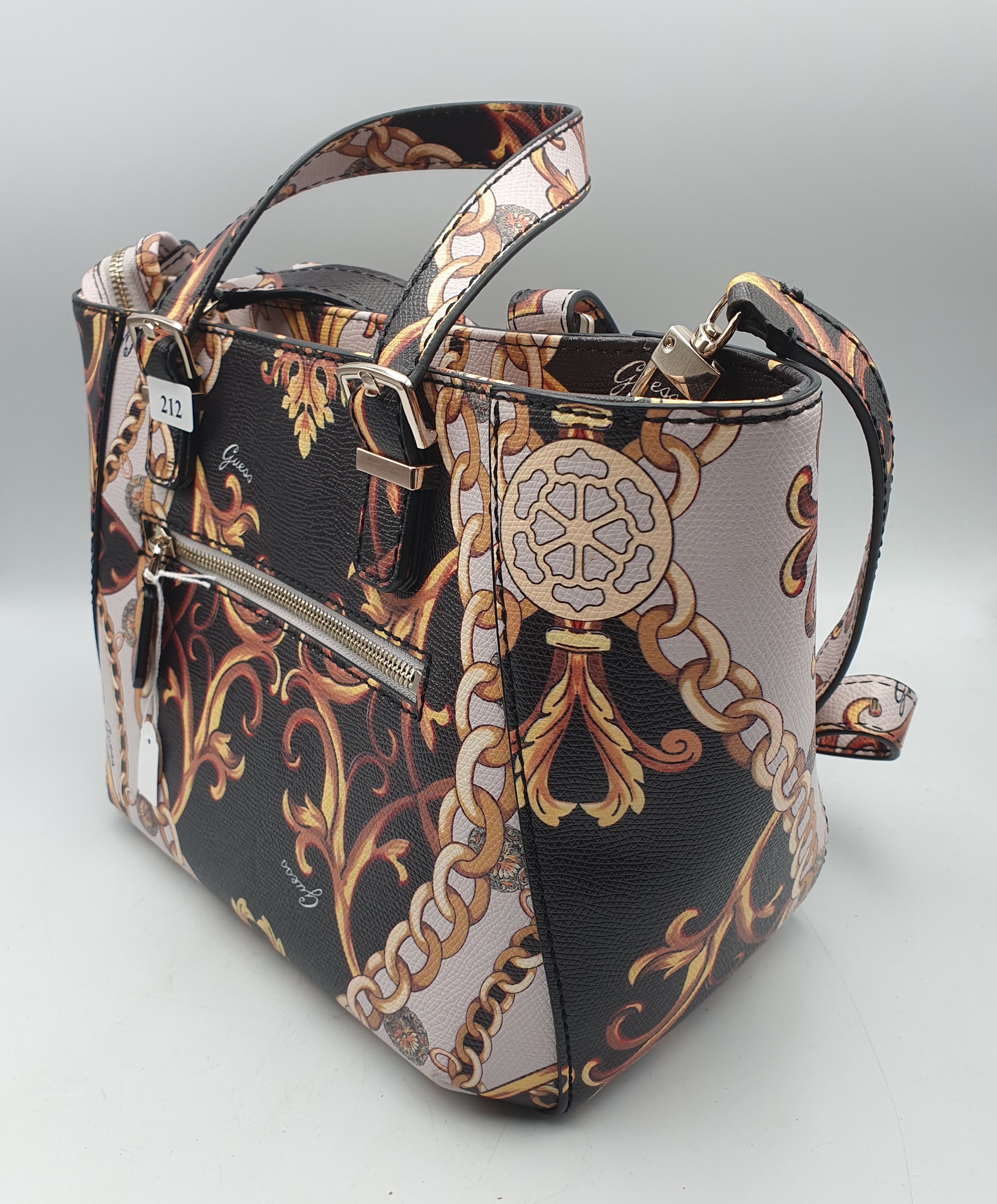 212 · A LADIES GUESS BAG