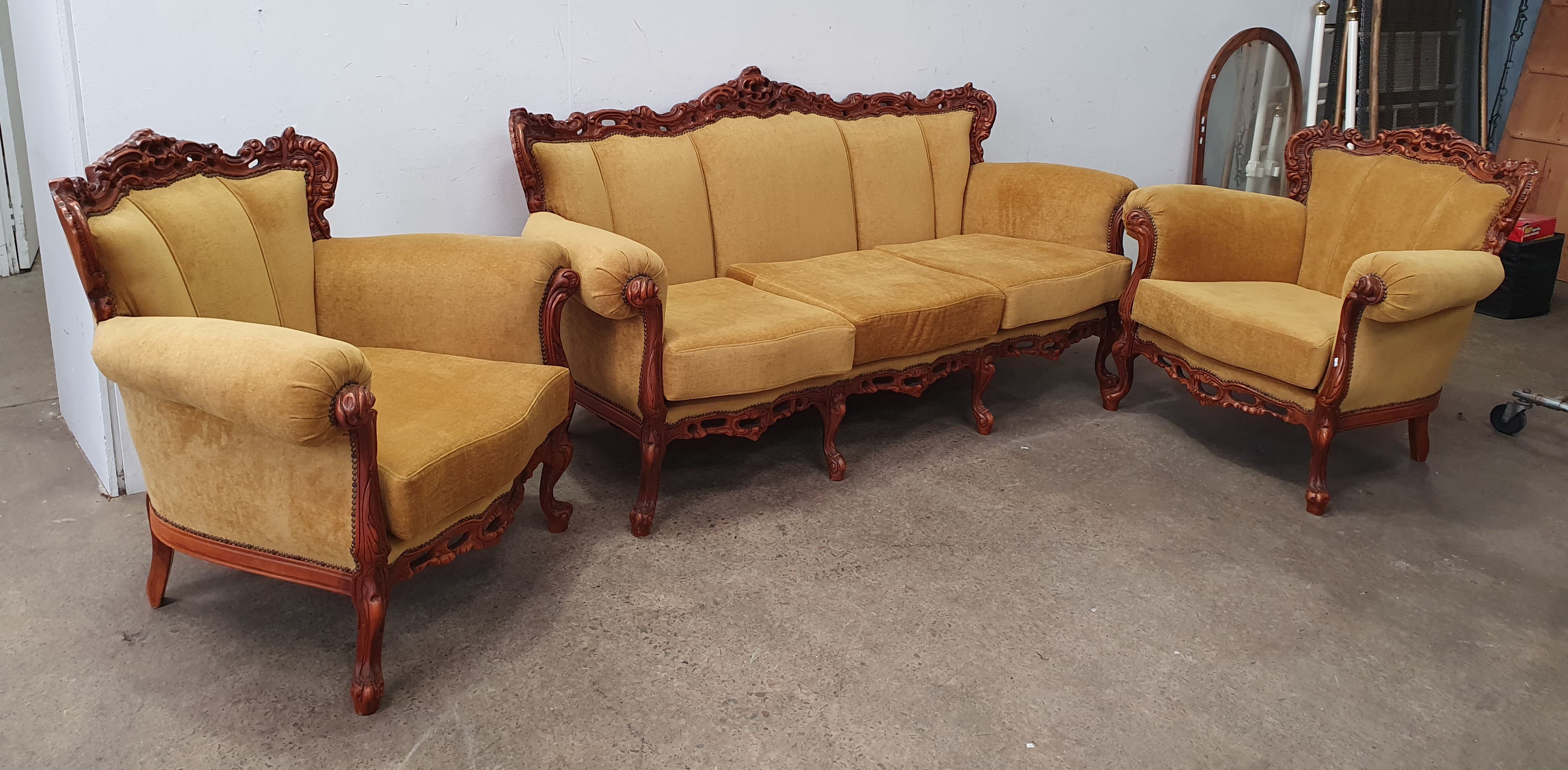 A Three Seater Ornate Timber Carver Sofa