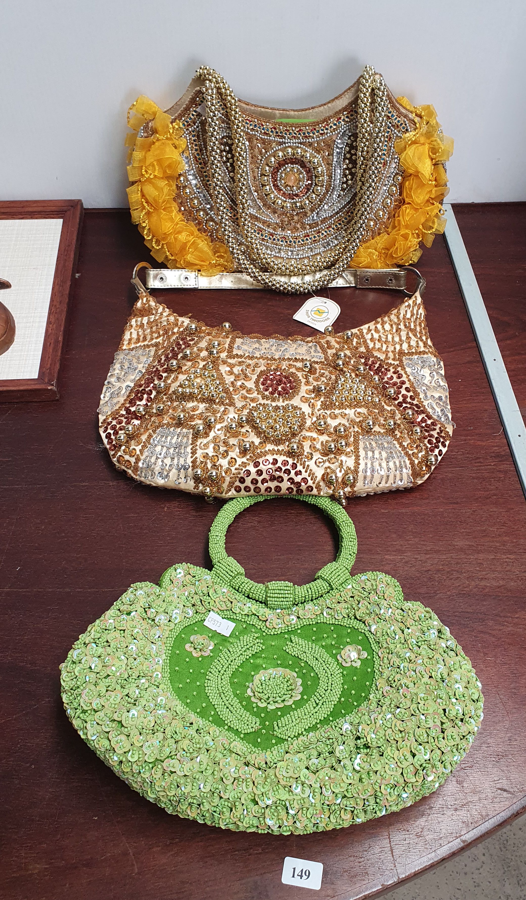 149 · THREE FASHION BEADED AND SEQUINNED HANDBAGS
