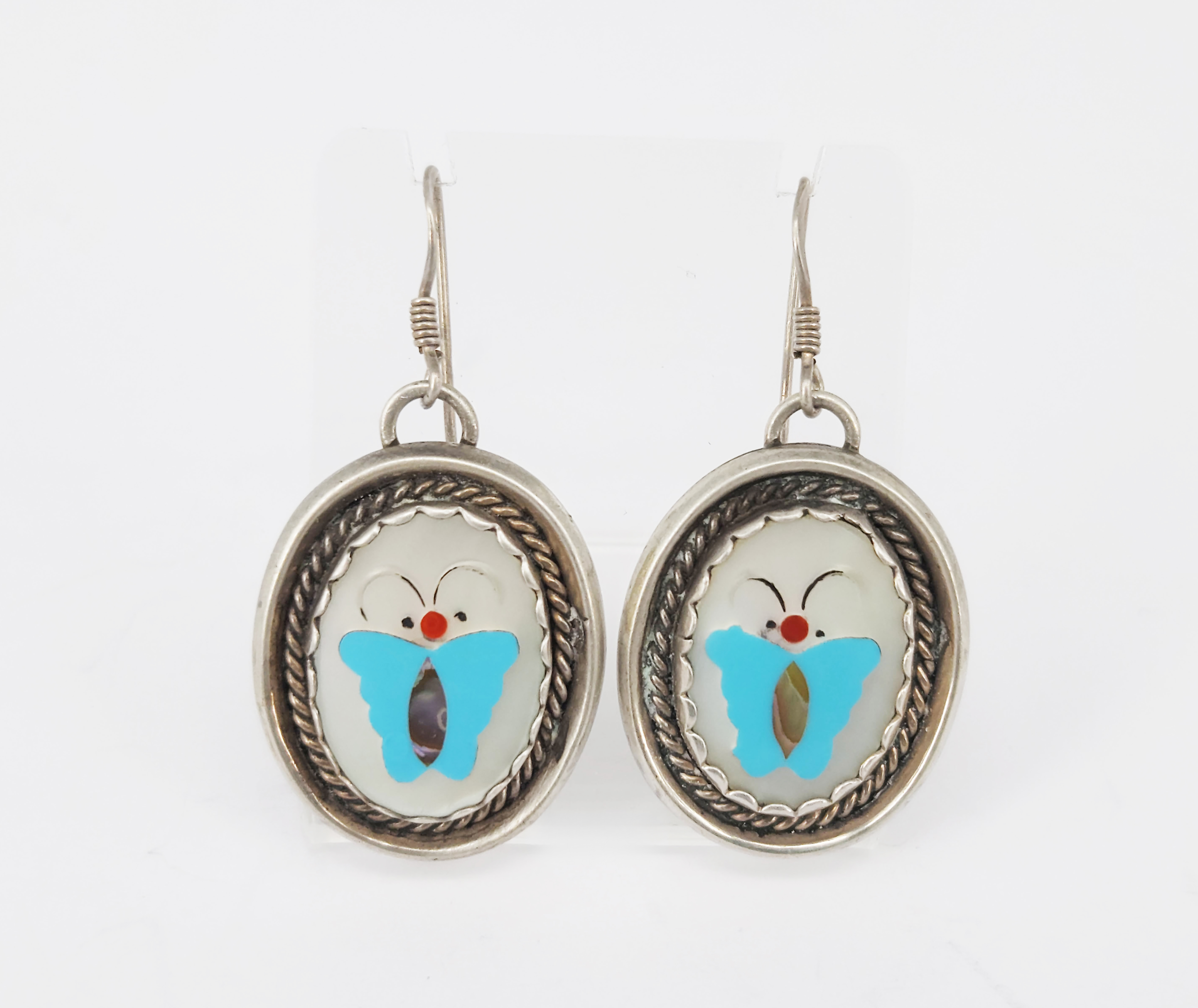 322 · A PAIR OF NATIVE AMERICAN SILVER INLAID EARRINGS