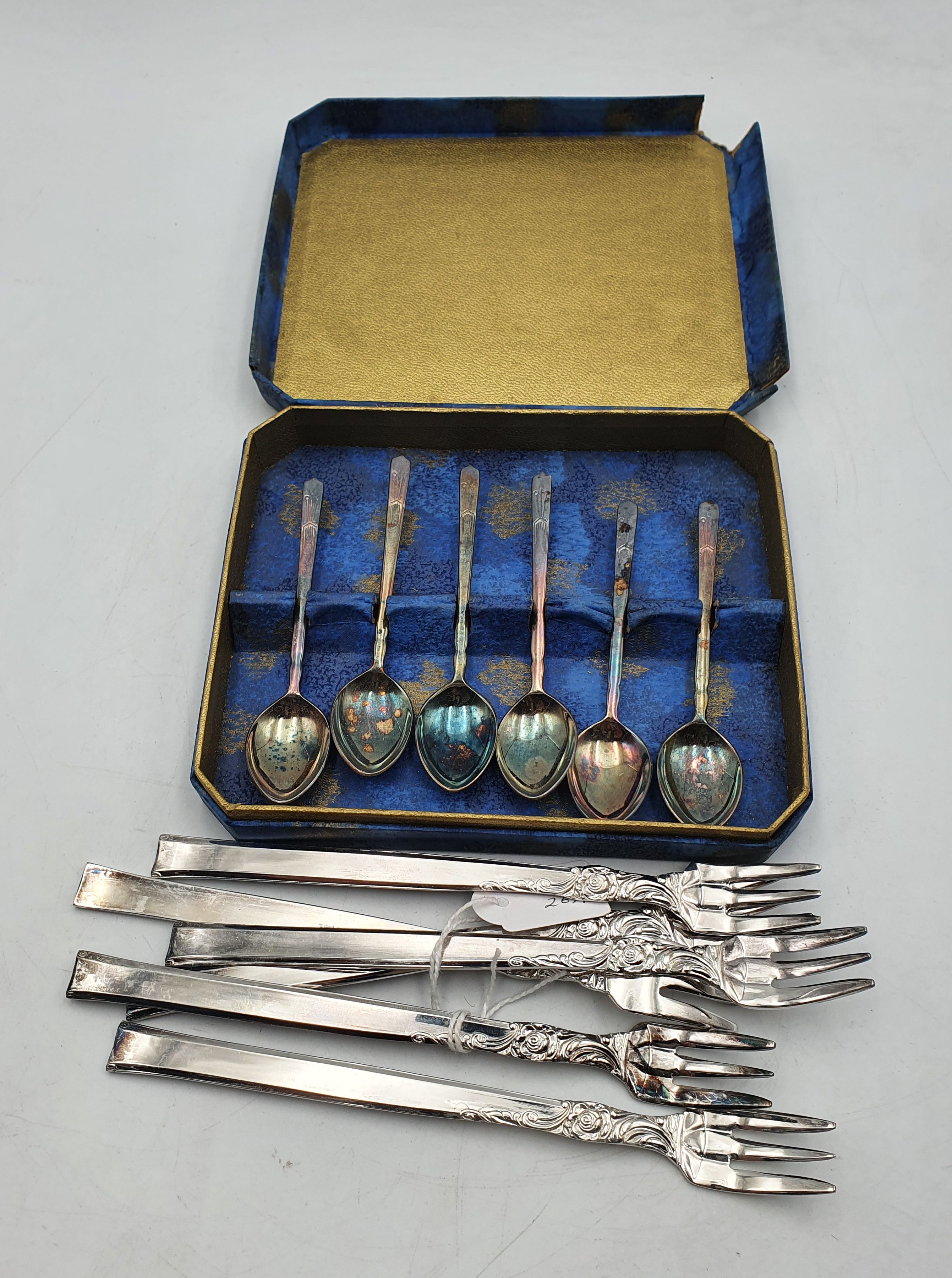 A BOXED SET OF COFFEE SPOONS TOGETHER WITH A SET OF SIX SILVERPLATED OLIVE FORKS