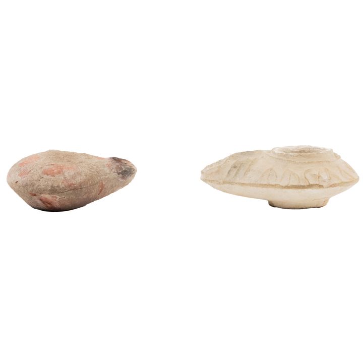 Two ancient Mediteranean buff or red pottery oil lamps