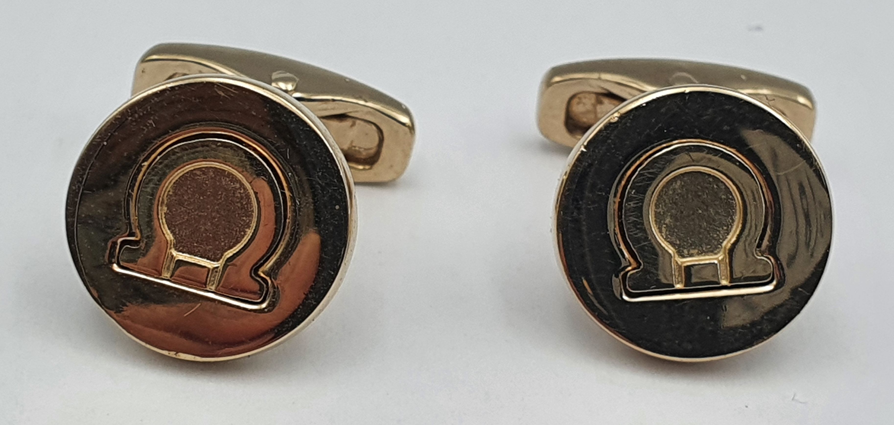 A Pair Of Omega Themed Men'S Cufflinks