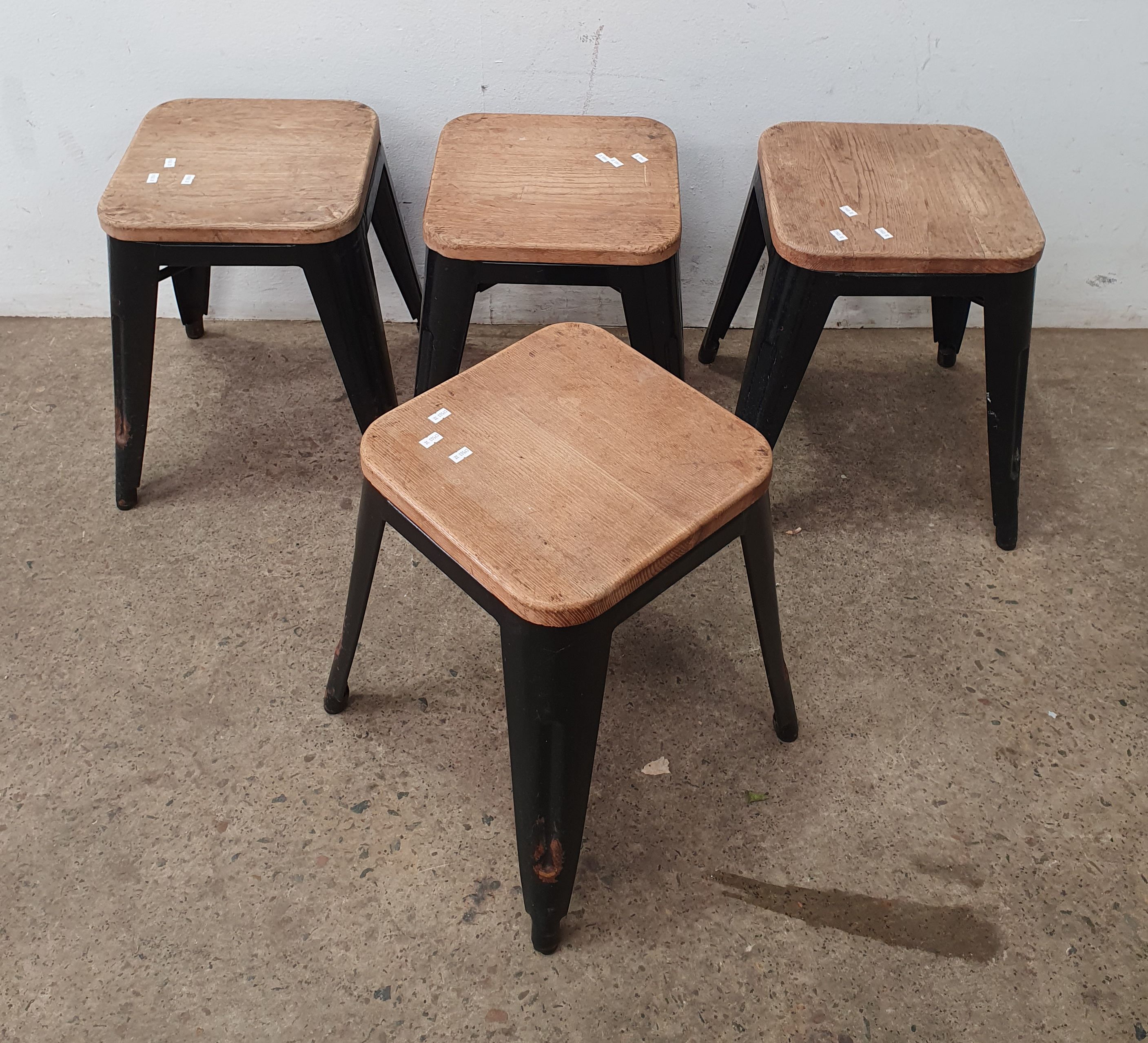 A Group Of Metal Based Four Stools
