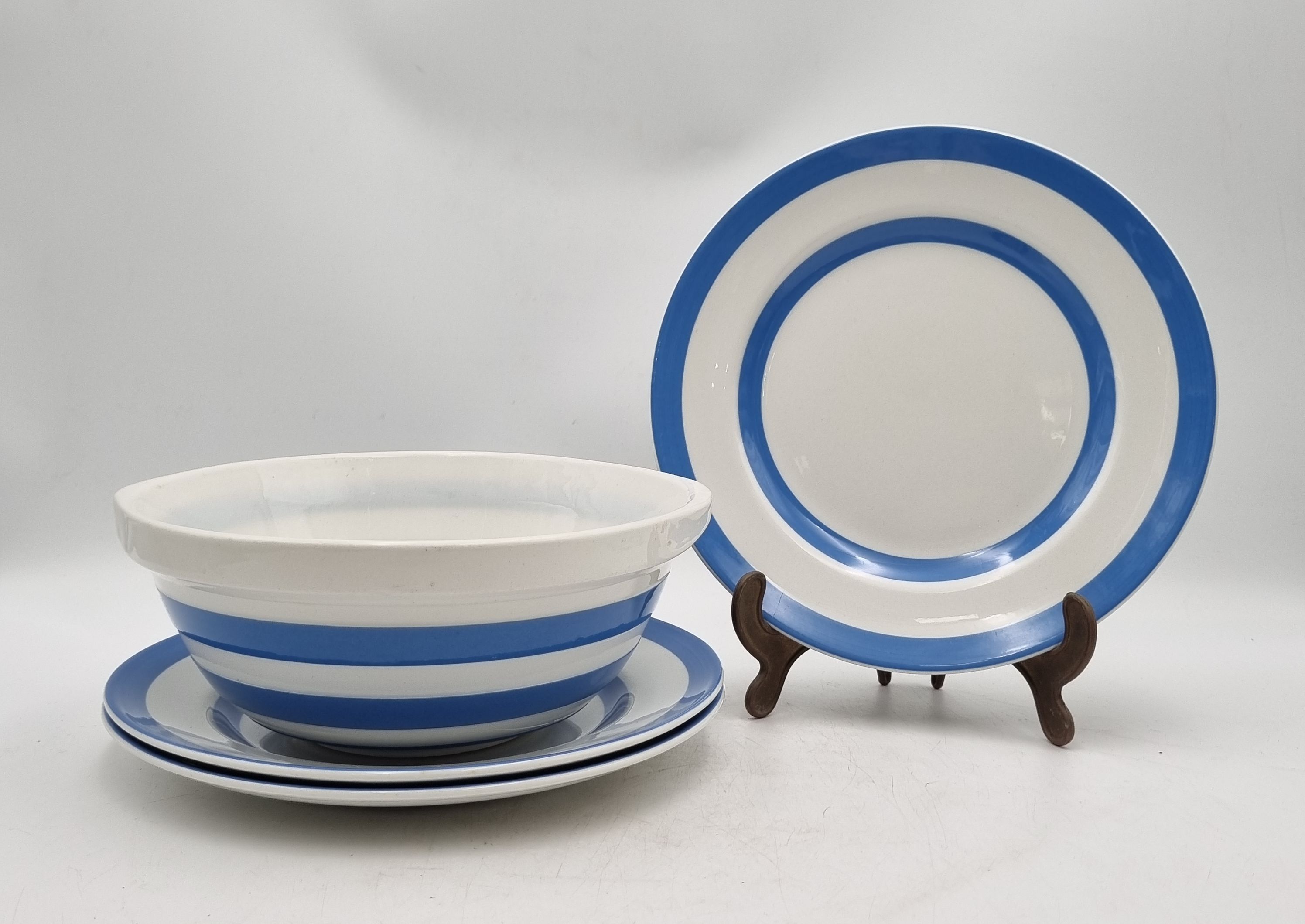 646 · THREE CORNISH KITCHEN WARE BLUE STRIPED ENTREE PLATES