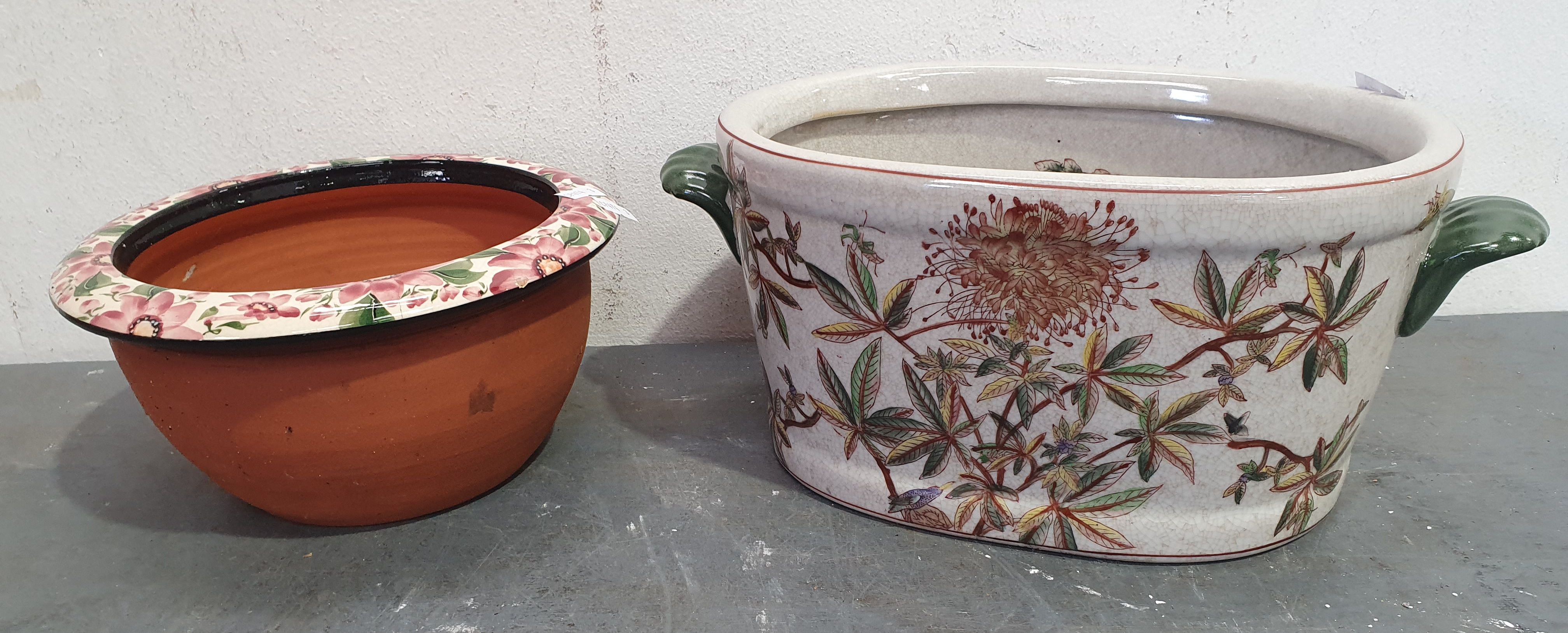 1338 · A CRACKED GLAZED POT WITH FLORAL DECORATIVE DESIGN