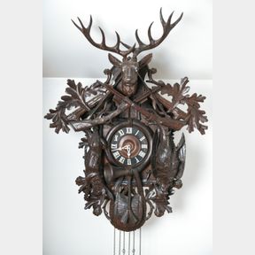 EXTENSIVELY CARVED BLACK FOREST CUCKOO CLOCK