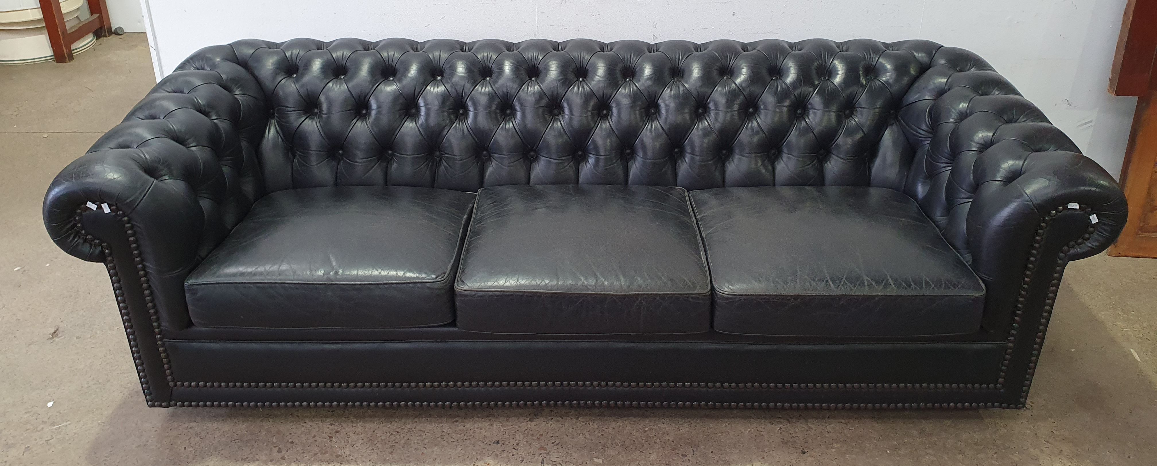 A Moran Leather Three Seater Chesterfield Sofa